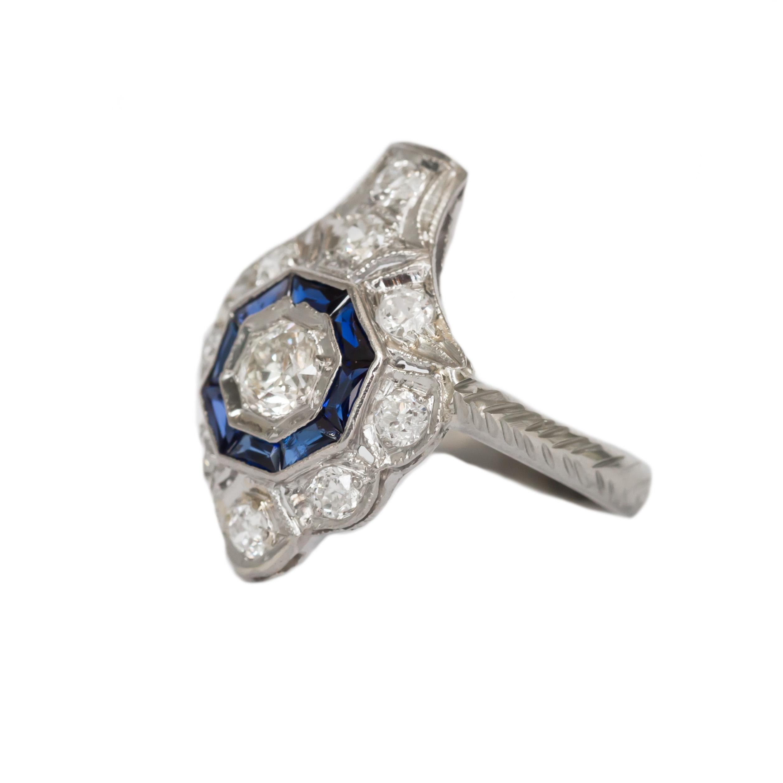 Ring Size: 4.25
Metal Type: Platinum & 14 karat White Gold 
Weight: 3.5 grams

Center Diamond Details
Shape: Old European Brilliant 
Carat Weight: .25 carat, total weight
Color: F
Clarity: VS

Side Stone Details: 
Type: Synthetic Sapphire 
Shape: