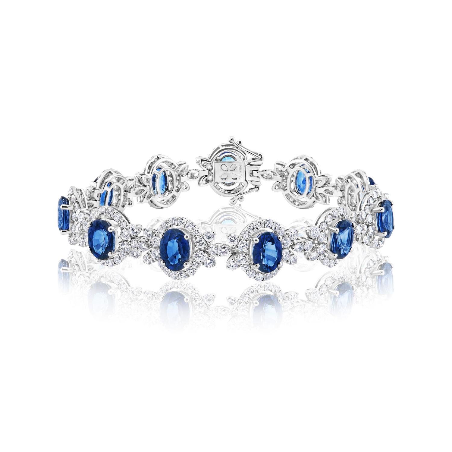 The Sadie 25 Carat Sapphire & Diamond Bracelet features OVAL CUT J'adore SAPPHIRE brilliants weighing a total of approximately 24.84 carats, set in 18K White Gold.

Style:
Sapphire Size: 17.56 Carats
Sapphire Shape: Oval Cut 

Halo Diamonds:
Diamond