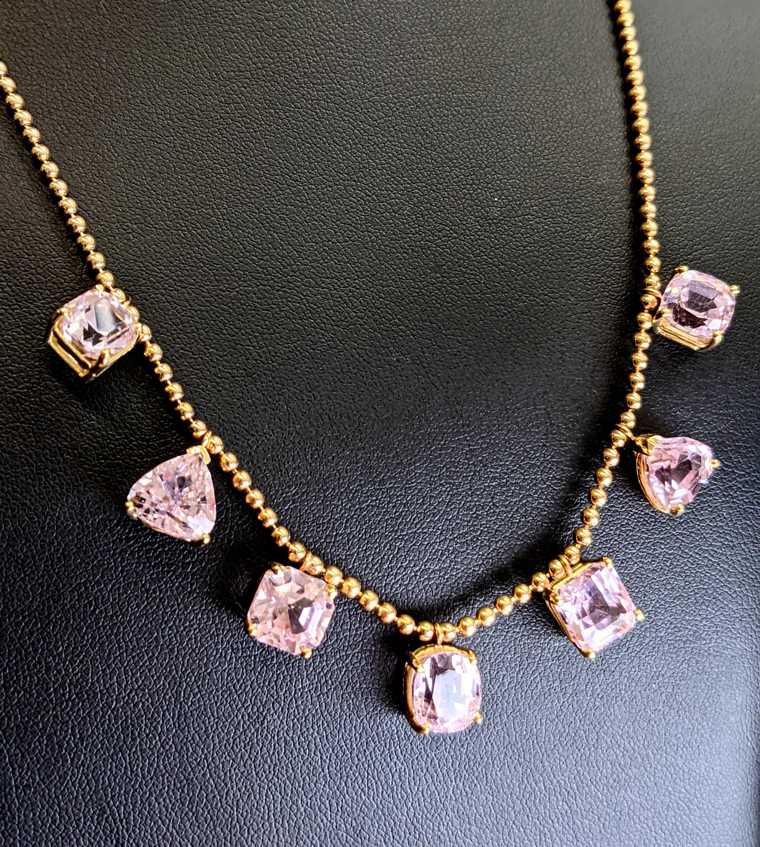 Elevate your style with this exquisite 18k yellow gold necklace, adorned with a delicate rose color array of natural Kunzites gemstone, 25 carat total weight, all in a variety of different cuts, in a exquisite curated order.
 Each Kunzite is