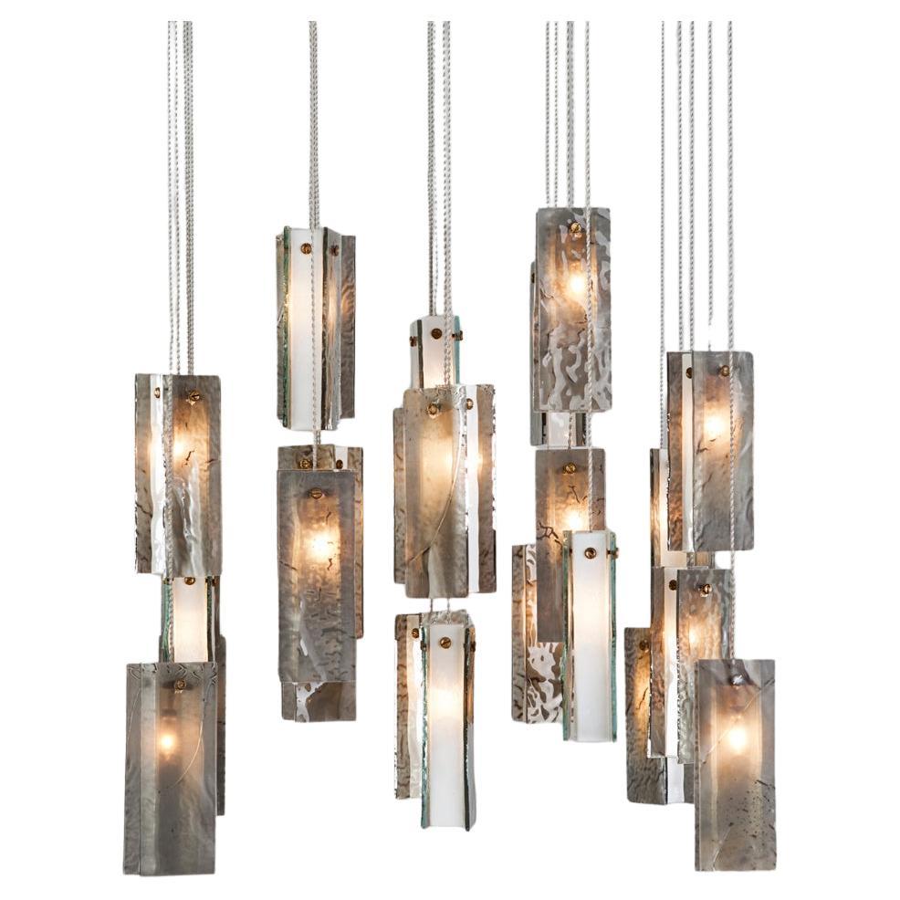 25 Pendant Chandelier
Can Be Made in Round, Rectangular, Squared Canopy

Transform your space with our unique multi-color drops chandelier. This chandelier can be used in all different settings such as a dining room, stairwell illumination, or