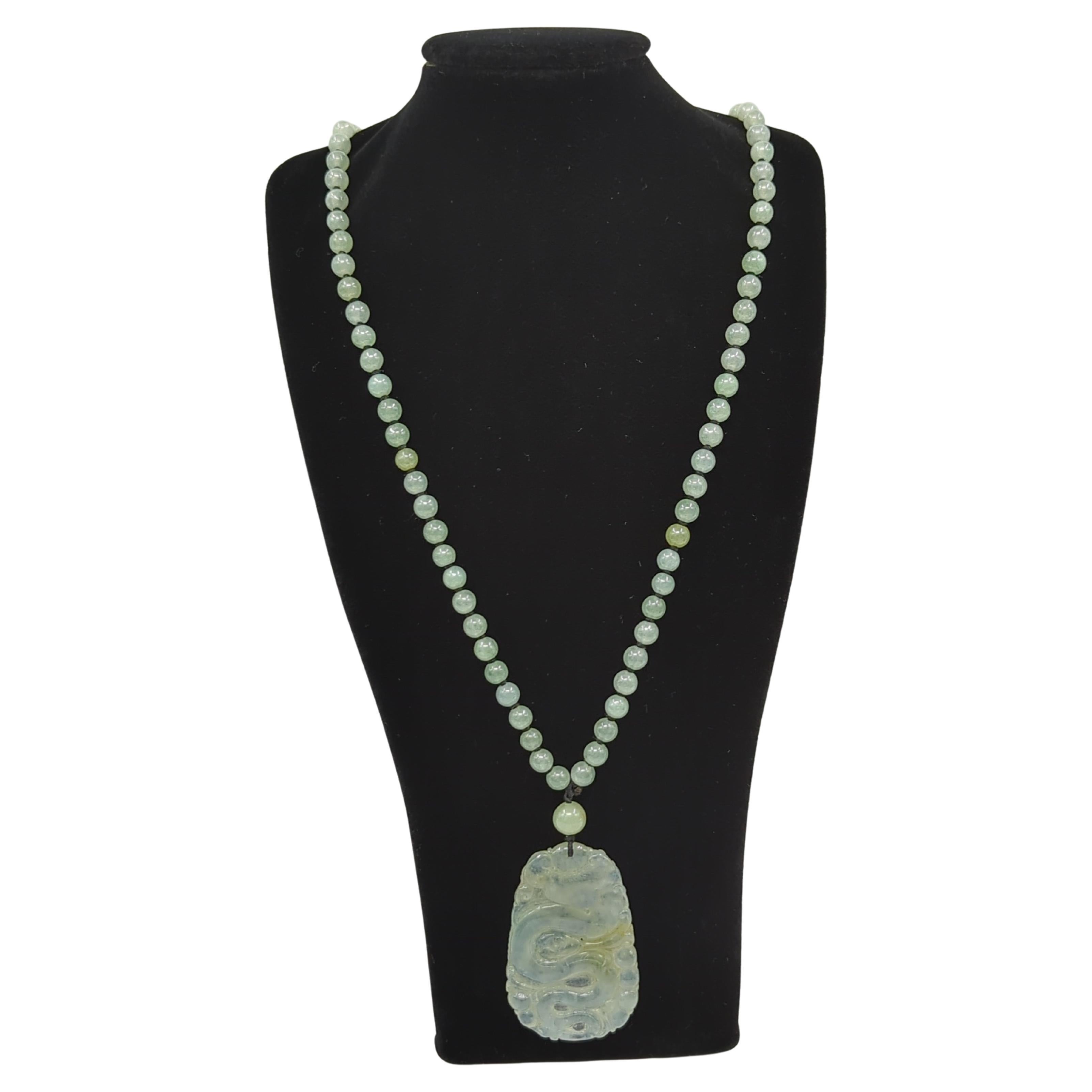 This exquisite icy jadeite beaded necklace showcases a 25