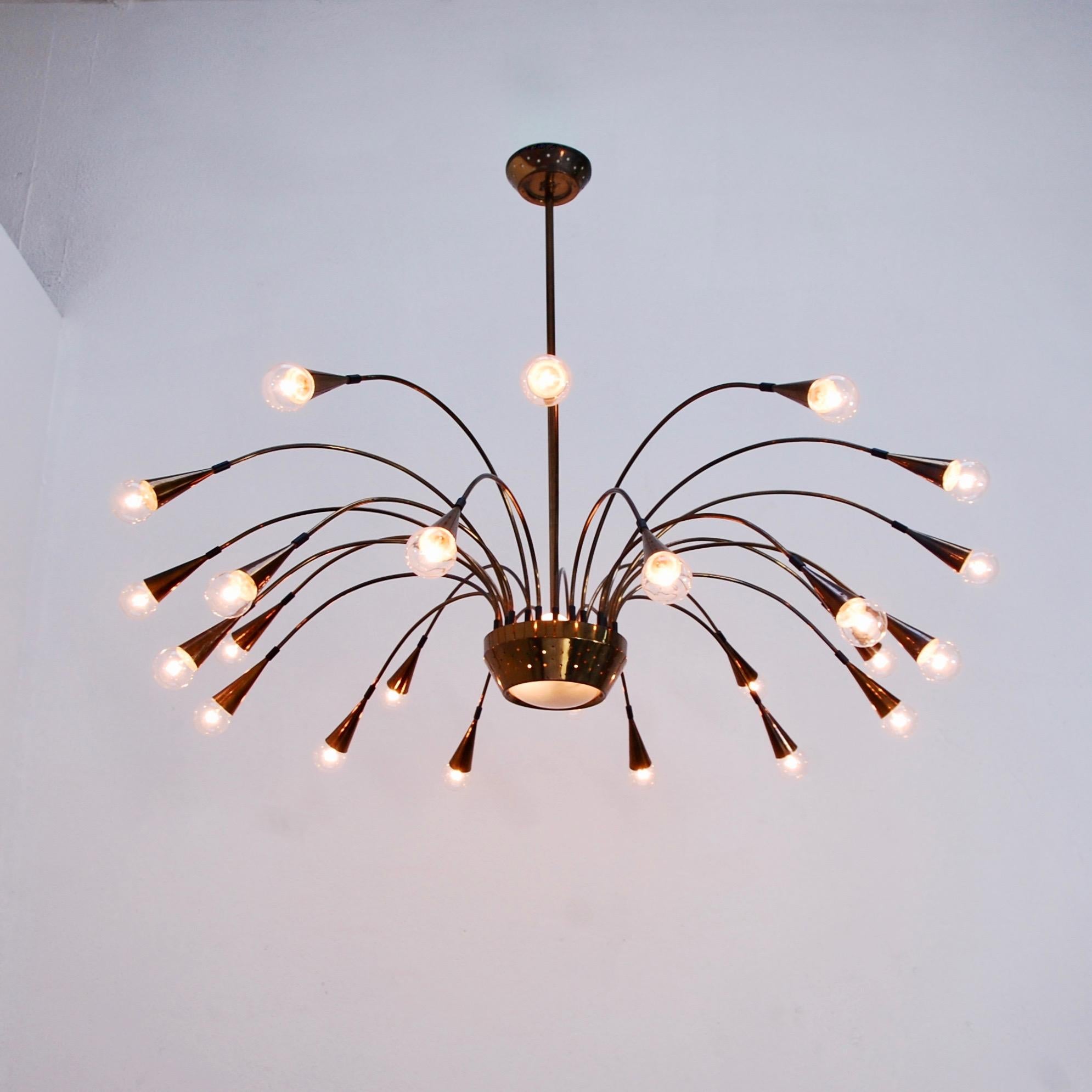 Large and expansive 25-light Italian 1950s midcentury Chandelier. Centre hub has 3 sockets emitting light in addition to the botanical arm lights. Original brass finish. E12 light bulbs. Light bulbs included.
Measurements:
Drop 32”
Fixture height
