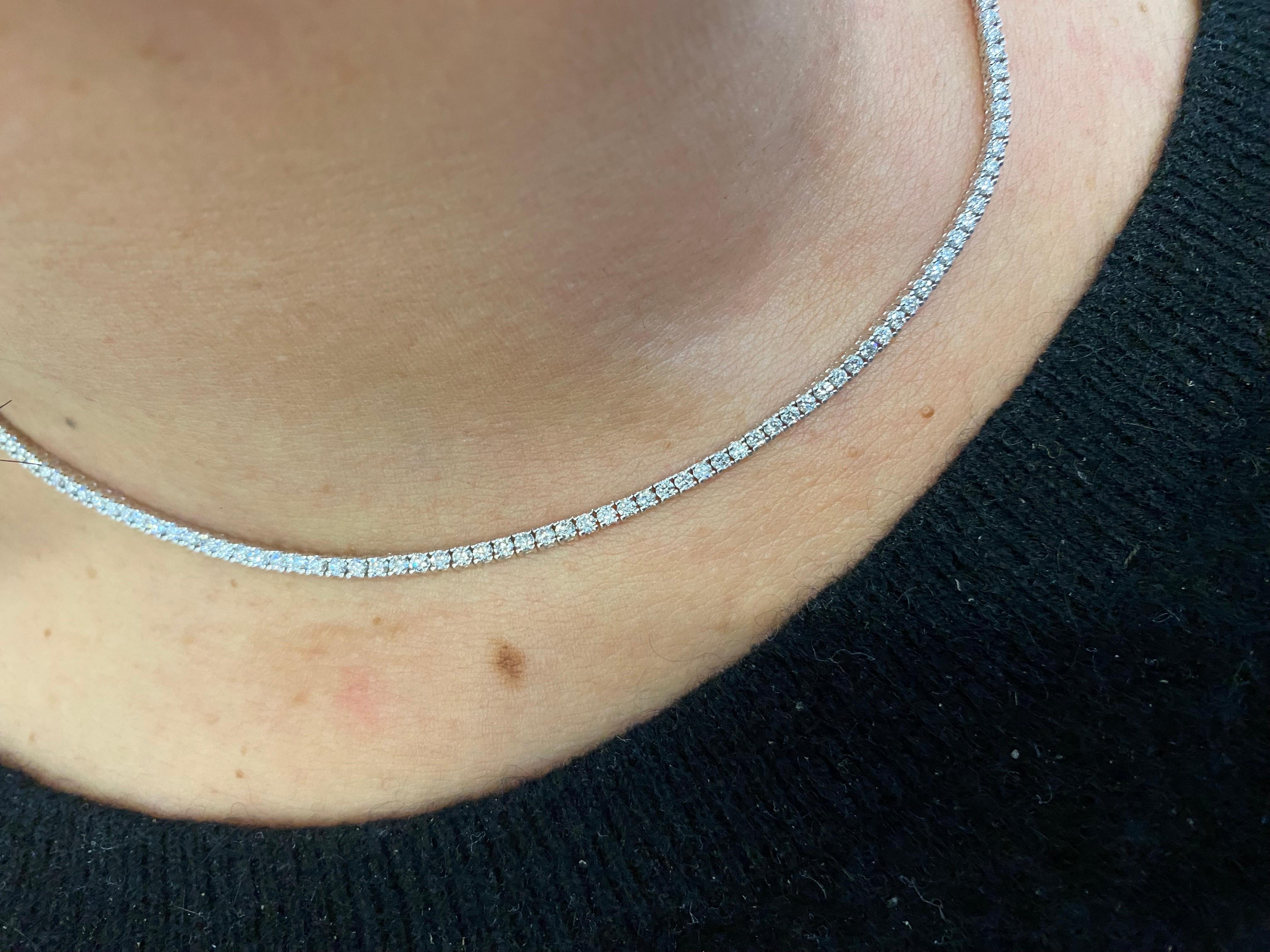 Diamond tennis necklace 16 inch set in 14K white gold. Each stone weighs 0.025 carats, and the total diamond weight is 4.81 carats. The color of the stones are G, the clarity is SI1-SI2.