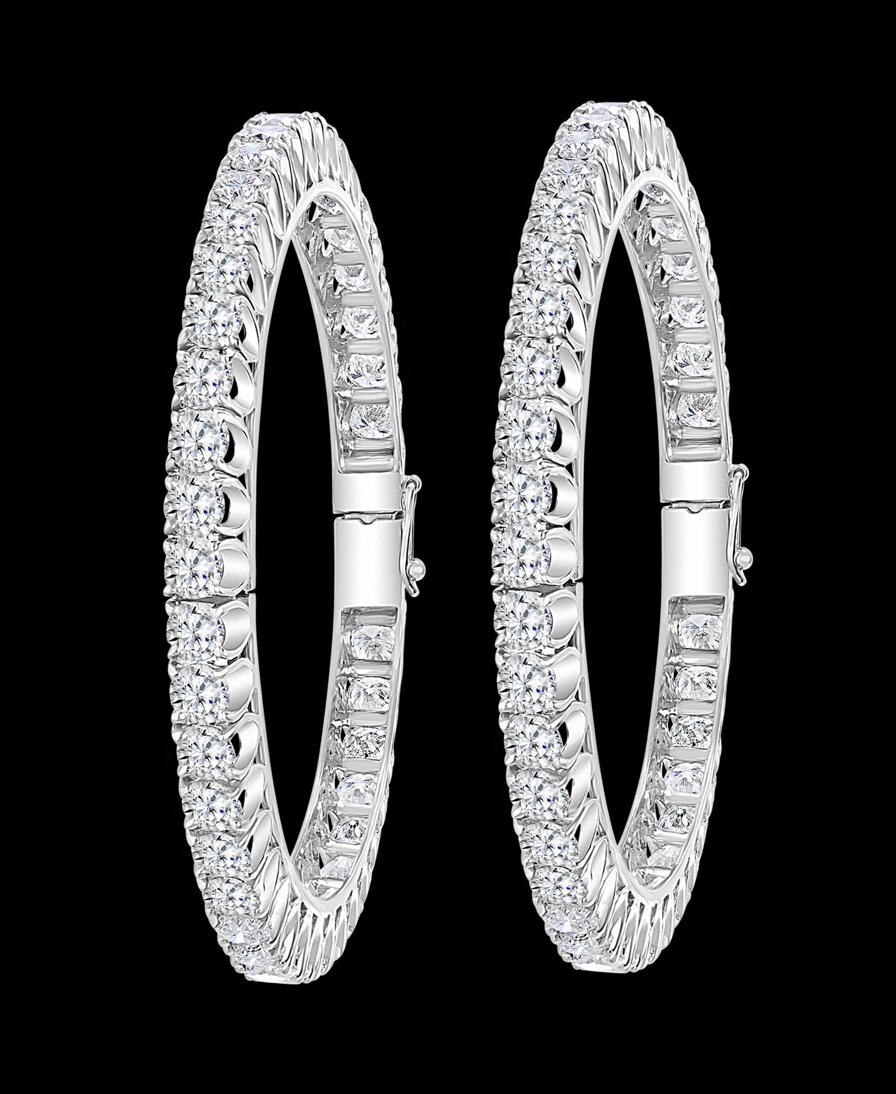 Single line 25 pointer  each , 25.26 Ct Contemporary  18 Karat  White  Gold & Diamond  Eternity Bangle Bracelet 
It features Two  bangles  crafted from  18k White gold   embedded with  25.26  Carats of  Round brilliant diamonds in two bangles . 
The
