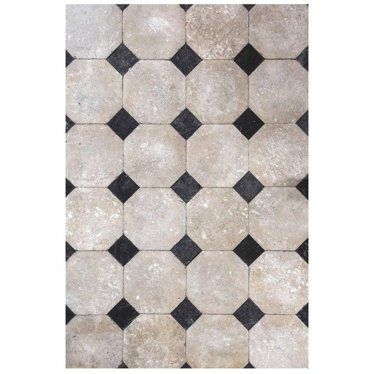 French octagonal flooring, 25 square feet.

Classically French, this black and white limestone flooring is what one might find in a grand chateau or manor house in Europe. This style of French flooring dates circa 1750s, these octagonal tiles lay