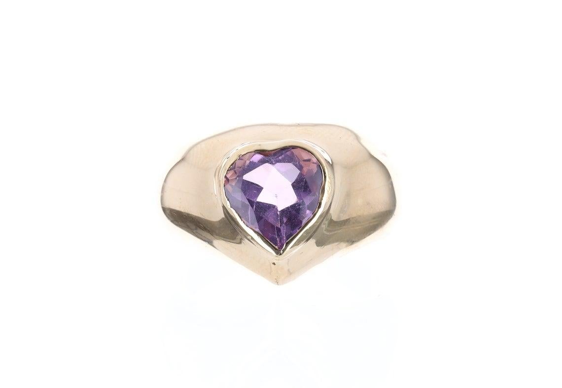 A timeless combination, a 2.50 carat royal natural heart amethyst, and handmade yellow gold ring 14k. Dexterously crafted in 14K solid yellow gold, this piece features a large genuine heart amethyst. A beautiful purple is paired with a warm yellow