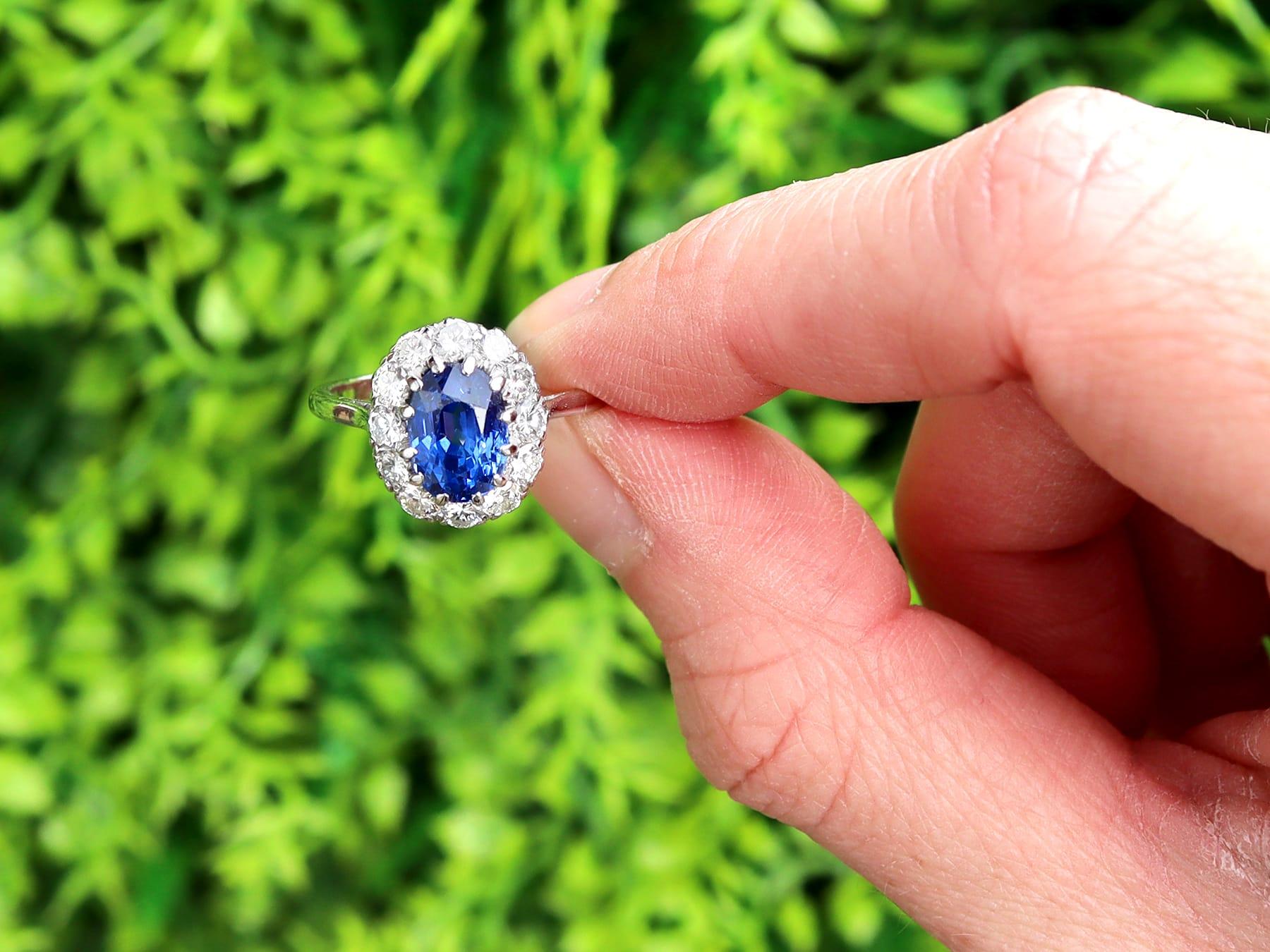 A stunning, fine and impressive vintage 2.50 carat Ceylon sapphire and 0.75 carat diamond, platinum cluster ring; part of our diverse vintage jewelry collections.

This stunning, fine and impressive unheated vintage sapphire engagement ring has been