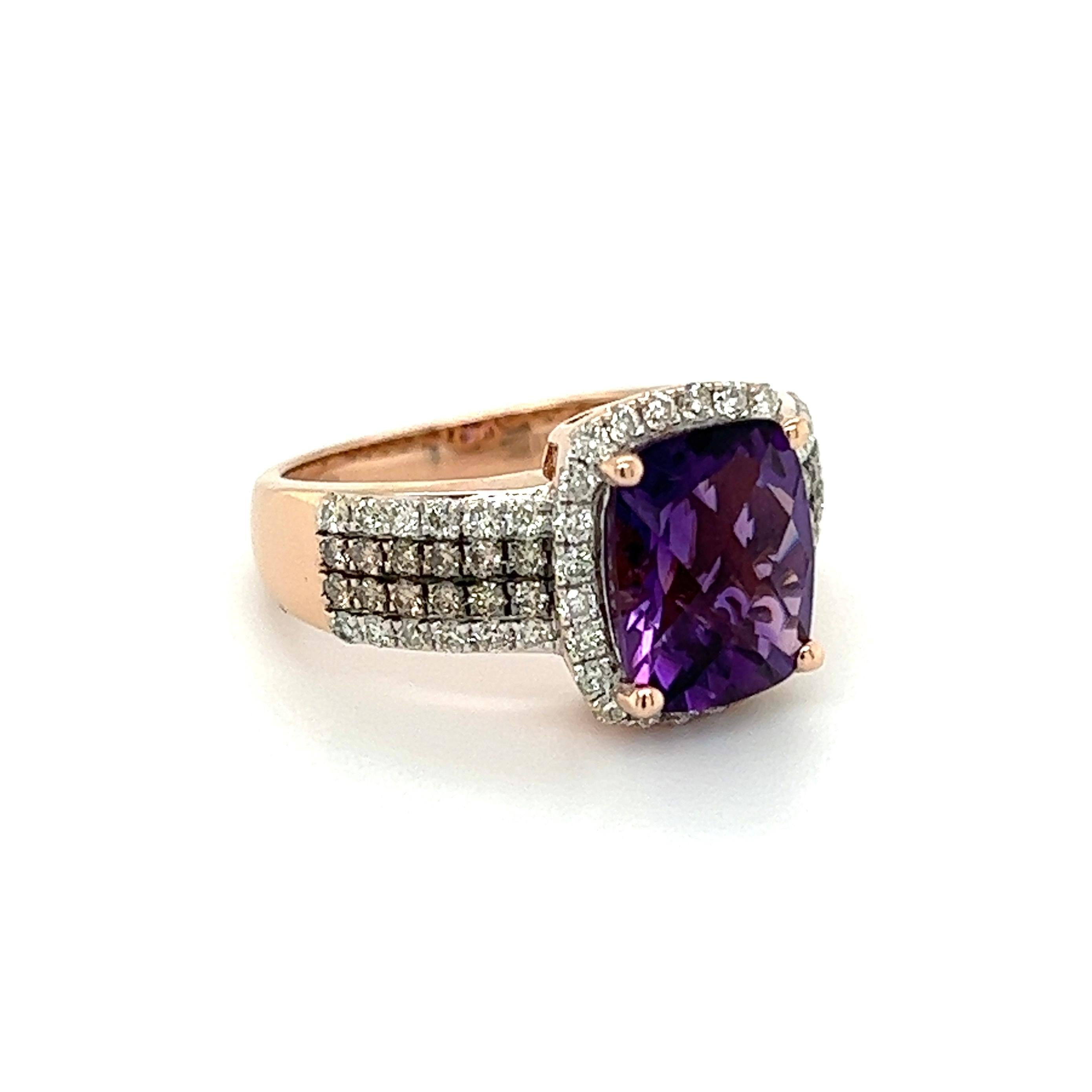 Simply Beautiful! Finely detailed Amethyst and Diamond Gold Cocktail Ring. Centering a securely nestled Hand set 2.5 Carat Checkerboard Amethyst. Surrounded by and enhancing the sides Champagne and White Diamonds, weighing approx. 0.72tcw. Hand