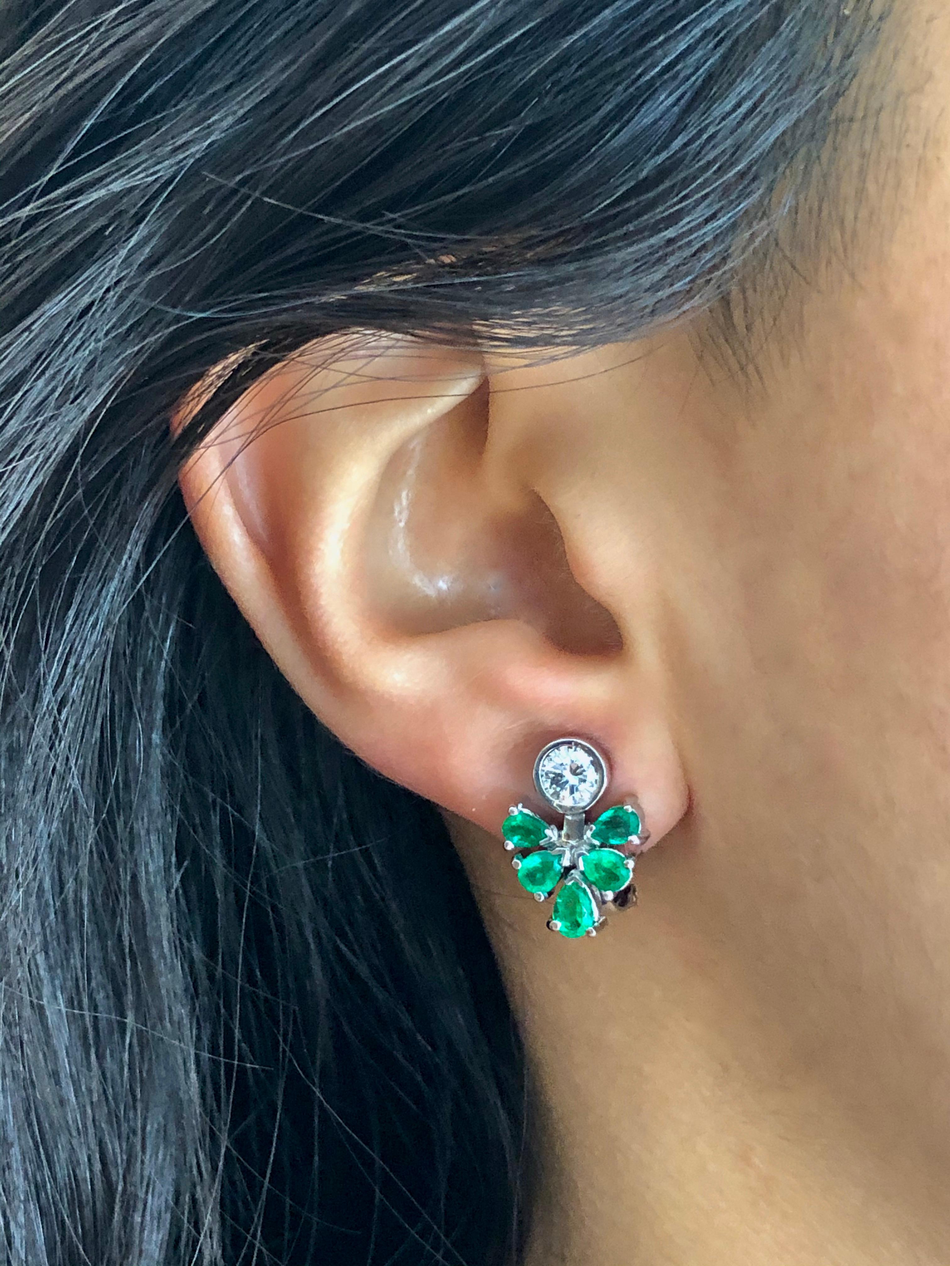 Gorgeous 2.50 Carat Colombian Natural Emerald Diamond Cluster Cocktail Clip-on Earrings.
Primary Stone: 100% Natural Colombian Emerald
Shape or Cut: Pear Cut
Emerald Weight: Over 1.55 Carats
Average Color/Clarity Emerald: AAA+ Intense Medium Bluish