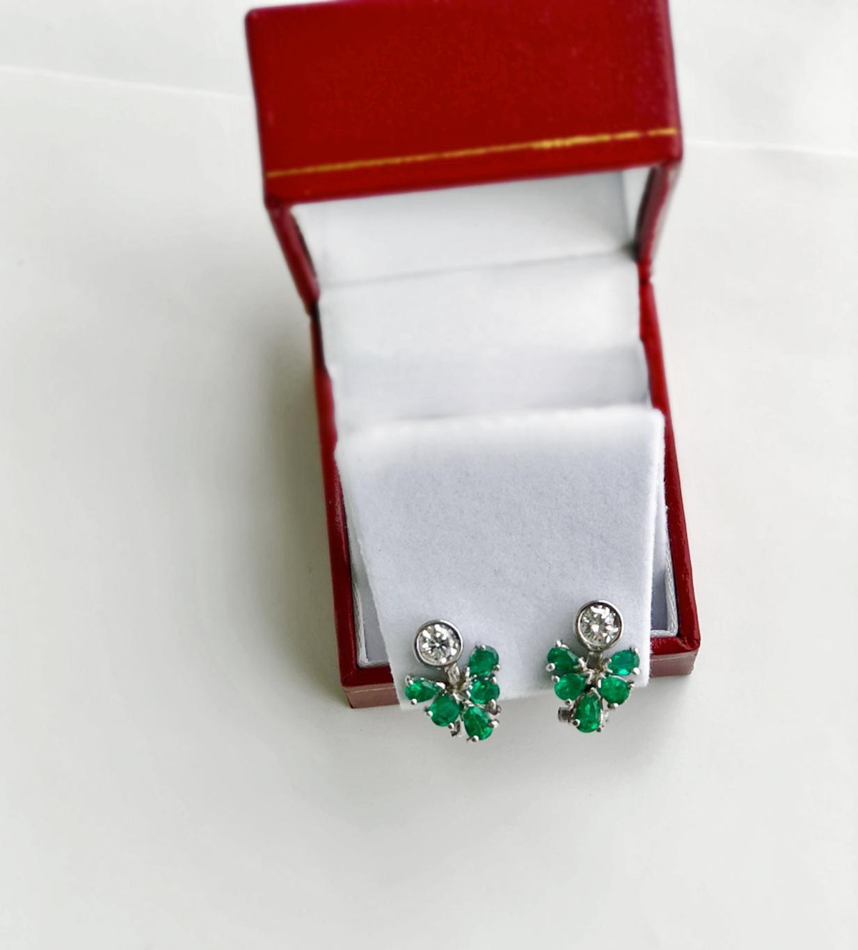 Gorgeous 2.50 Carat Colombian Natural Emerald Diamond Cluster Cocktail Clip-on Earrings.
Primary Stone: 100% Natural Colombian Emerald
Shape or Cut: Pear Cut
Emerald Weight: Over 1.50 Carats
Average Color/Clarity Emerald: AAA+ Intense Medium Bluish