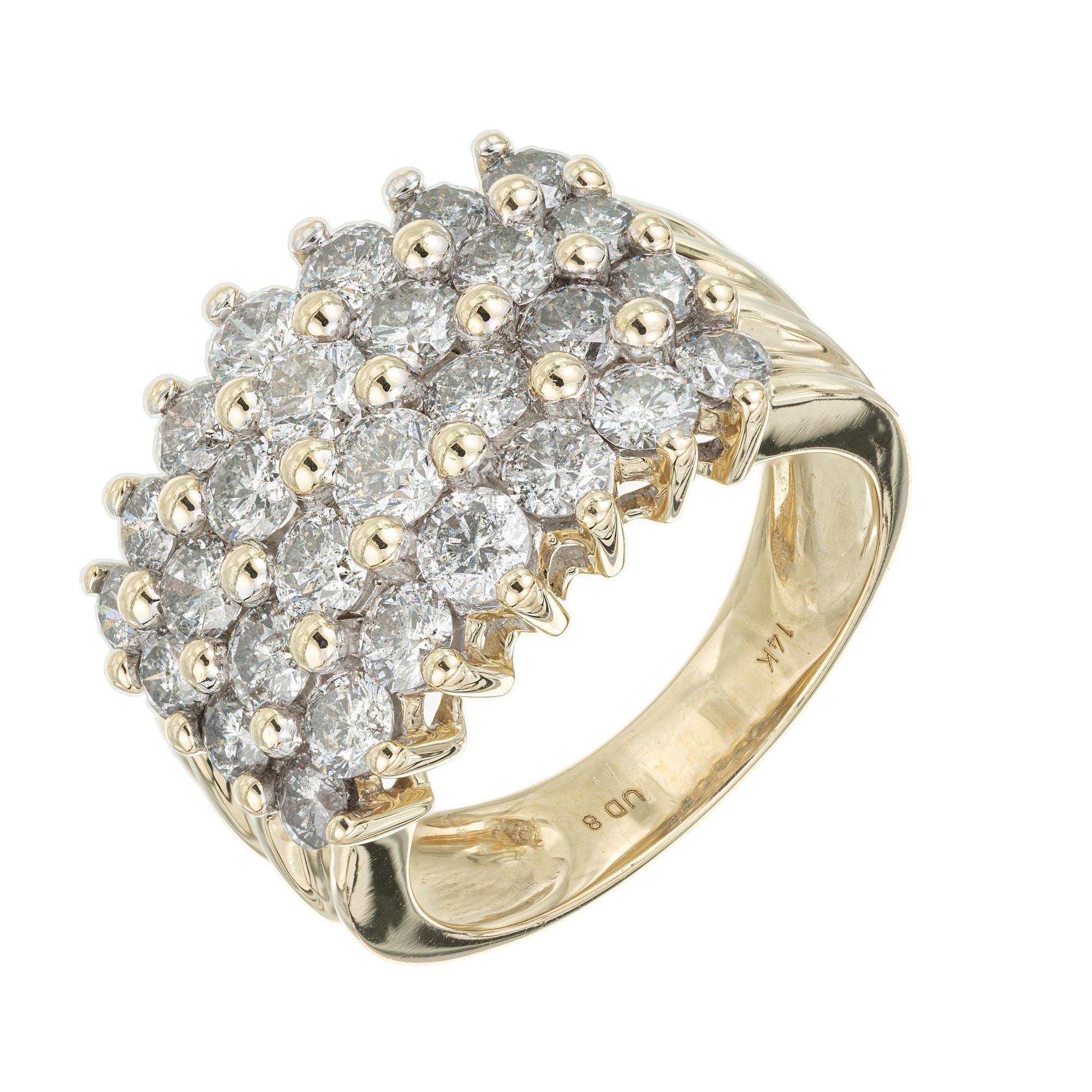 1980's Four row diamond band ring.  2.50cts of round diamonds set in a 14k yellow gold cluster setting. 

28 round diamonds, approx. total weight 2.50cts, H, SI1 – SI2
Size 7 and sizable
14k Yellow Gold
Tested and stamped: 14k
Hallmark: UD8
9.0