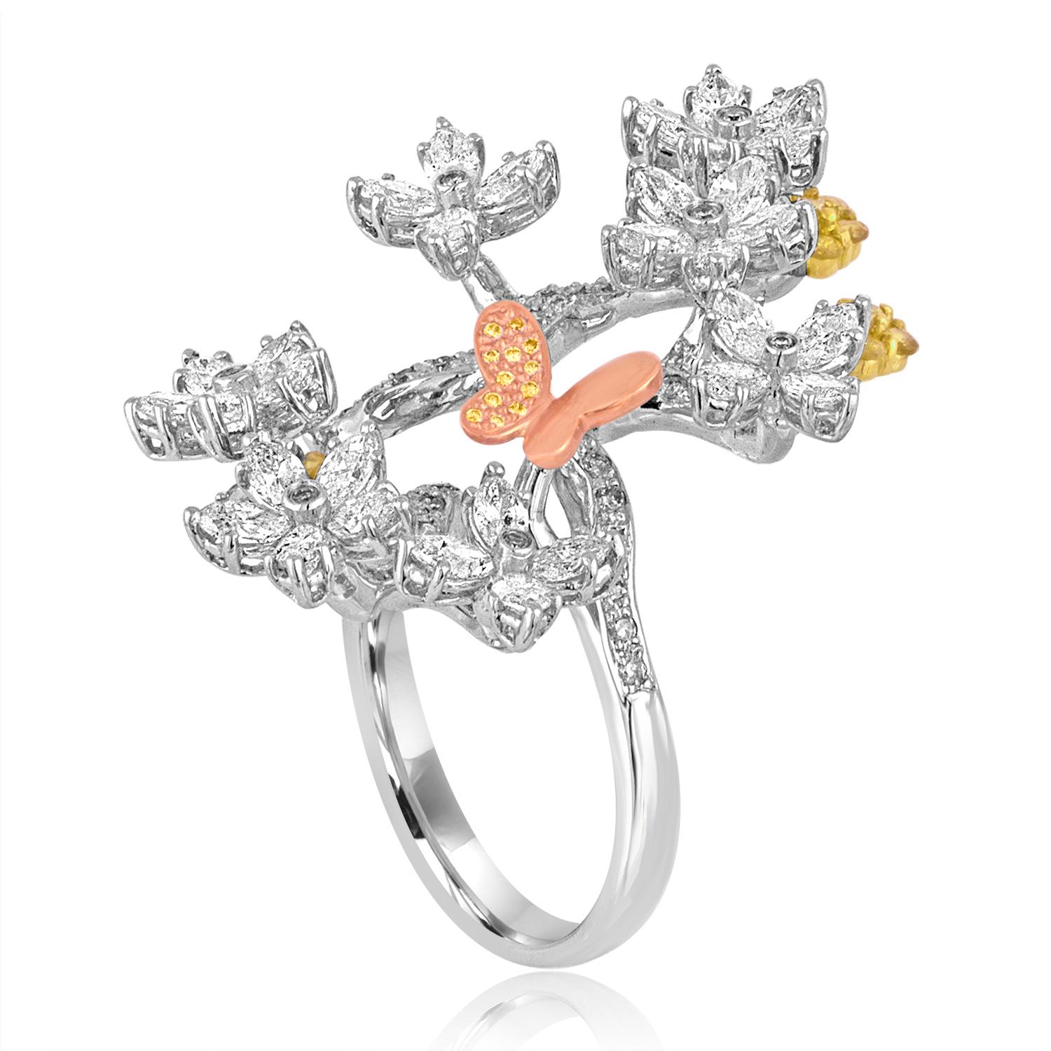 Very Unusual Flower Branch Ring
The ring is 18K White, Yellow, Rose Gold
There are 2.50 Carats in Diamonds G/H SI
The ring is a size 6.75, sizable
The ring measures 1.5