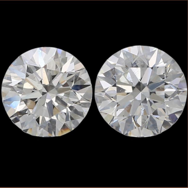 This gorgeous 2.02ct matched pair of round brilliant cut natural diamonds are very well cut, bright white, and have dazzling sparkle and brilliance! This is a particularly bright and lively pair! They are 100% natural earth mined diamonds and have