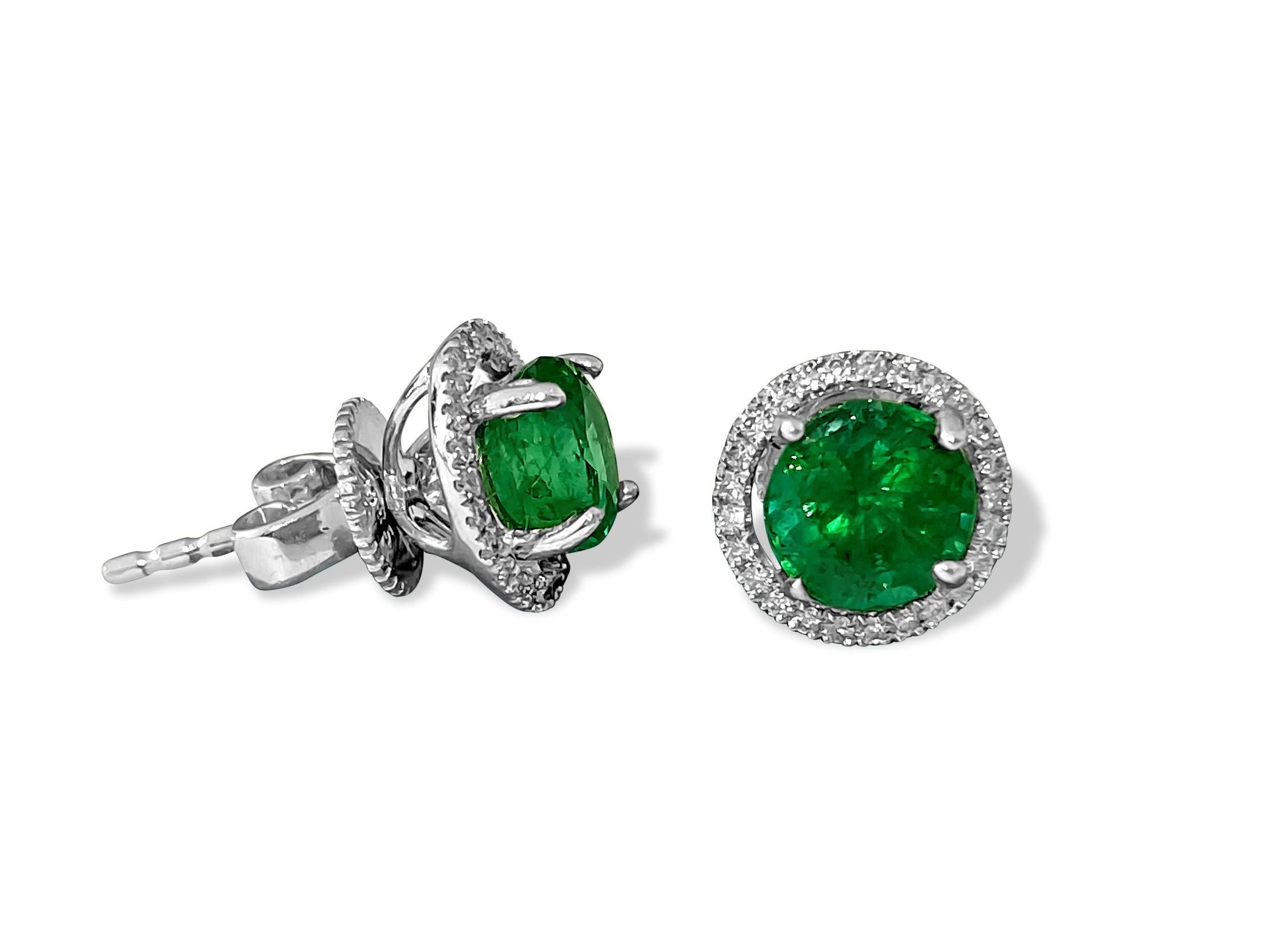 Metal: 14k white gold. 
Diamonds: 0.50 carats total, G color and VS clarity. Round brilliant cut diamonds set in prongs.

Emerald weight: 2.00 carats total. Round shape set in prongs. 100% natural earth mined precious stones.

Push back studs. An