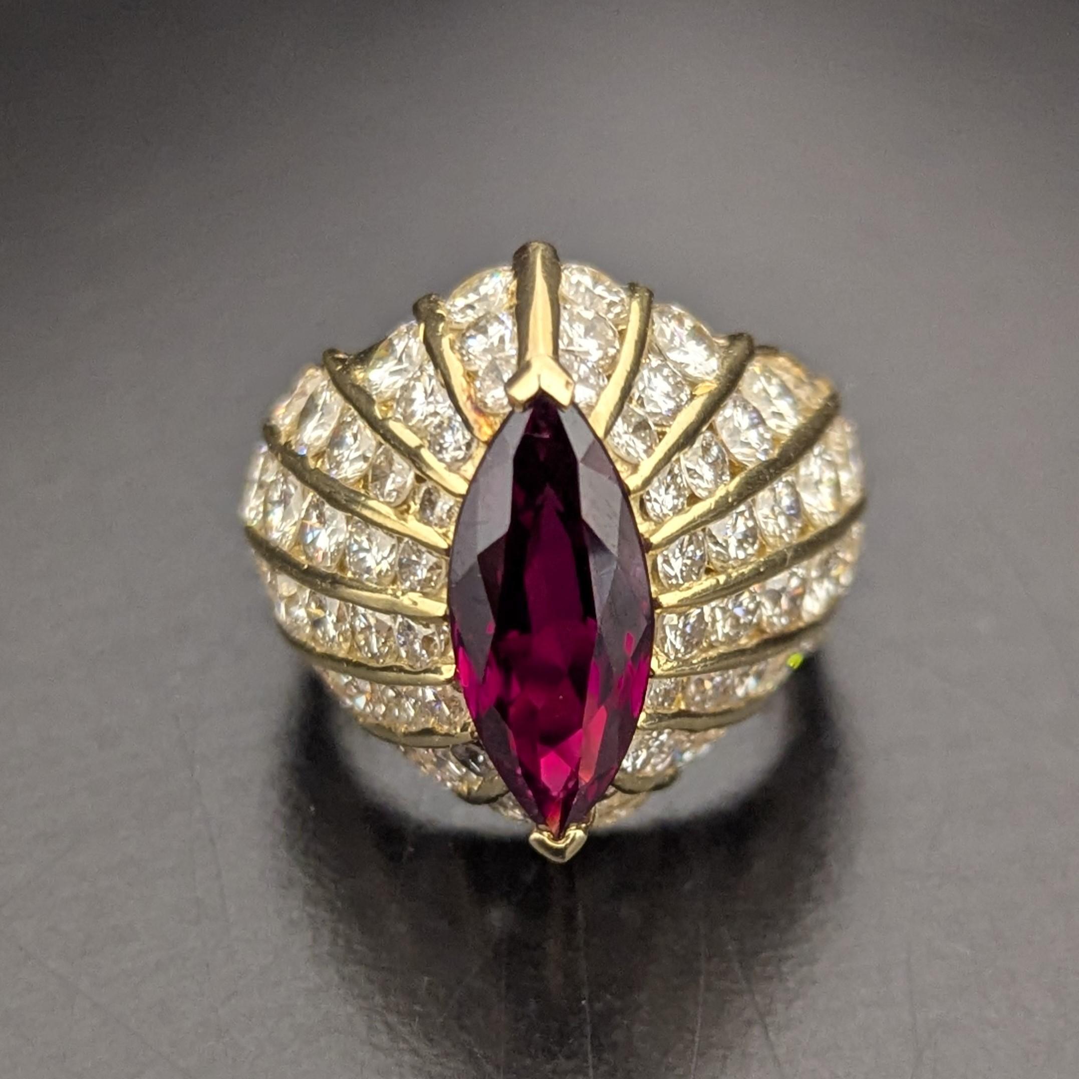 This beautiful dome-shaped ring features a centering marquise-shaped deep purplish-red ruby, weighing approximately 3 carats, encircled by 64 round diamonds, weighing approximately 4.10 carats, 
