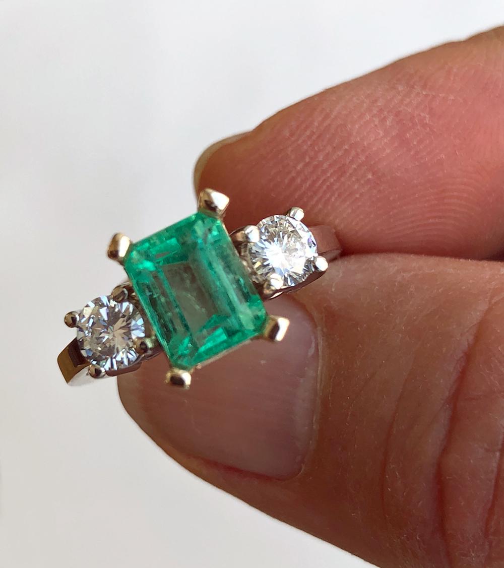 Primary Stones: Natural Colombian Emerald
Shape or Cut: Emerald Cut
Color/Clarity : Medium Light Green/ Clarity VS
Total Emerald Weight : 1.87 carats (8.0mmx6.0mm)
Second Stone: Diamonds Round Cut, 0.61ct  H/VS2-SI1
Ring Measurement: 15.50mm x