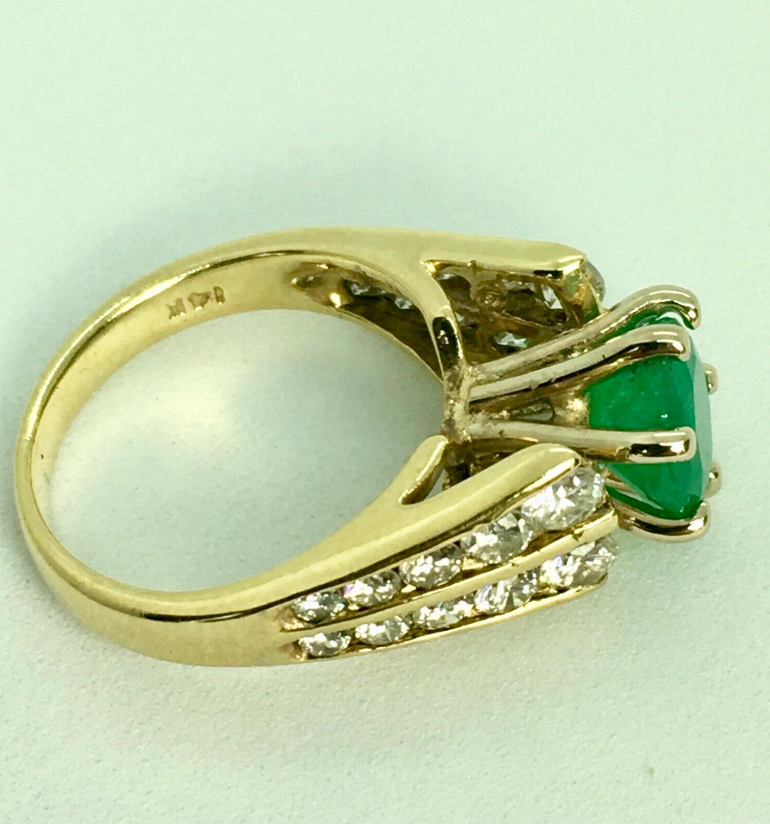 Stunning Estate 2.50 Carats Natural Colombian Emerald Solitaire Ring Diamond Accents
Shape or Cut: Round 
Emerald Weight: 1.50 Carats (1 emerald) 
Color: Natural FINE Medium Green 
Accent Stones: Diamond G-VS-SI1  Approx 1.0 Carat
This gorgeous