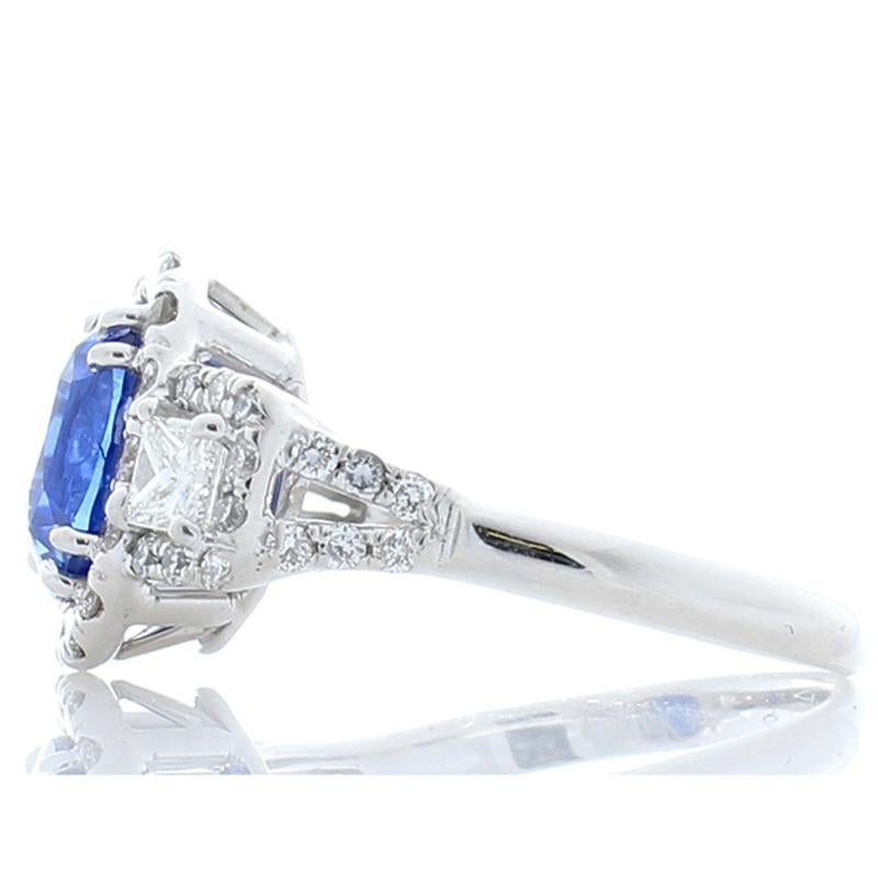 Every head will turn to sneak a peek at this uniquely one-of-a-kind ring. An illuminating 2.50 carat oval sapphire is set in the center and commands to be noticed. The sapphire is from Sri Lanka. Its color is royal blue. Its luster and clarity are