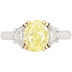 2.50 Carat, Platinum, Gold, Fancy Intense Yellow Diamond and Diamond Ring