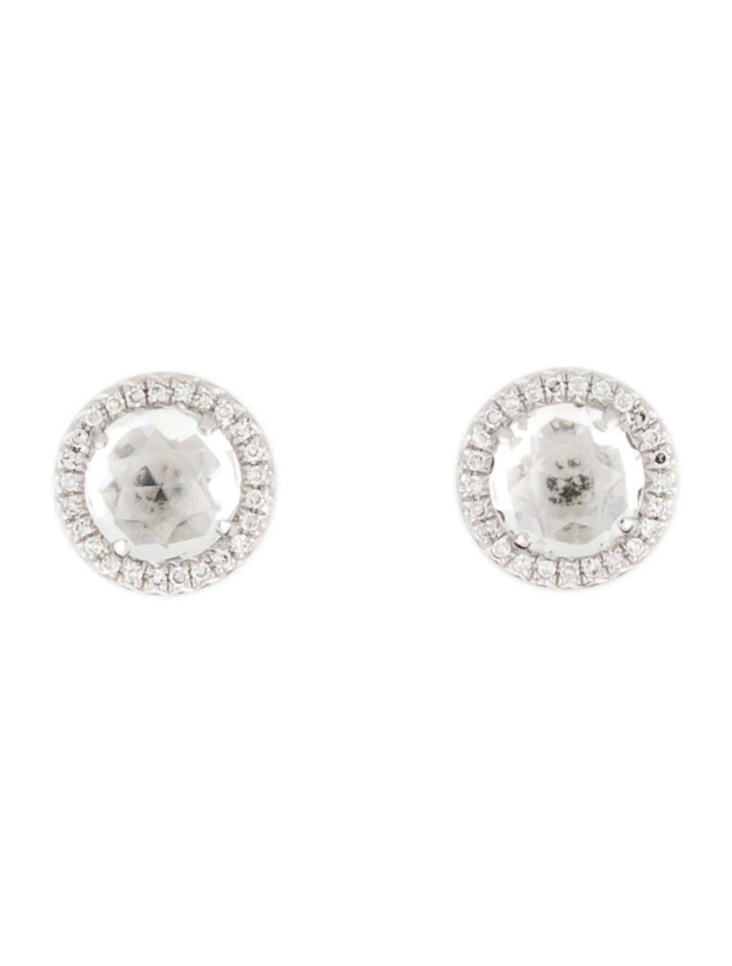 These White Topaz & Diamond Earrings are a stunning and timeless accessory that can add a touch of glamour and sophistication to any outfit. 

These earrings each feature a 1.25 Carat Round White Topaz, with a Diamond Halo comprised of 0.06 Carats