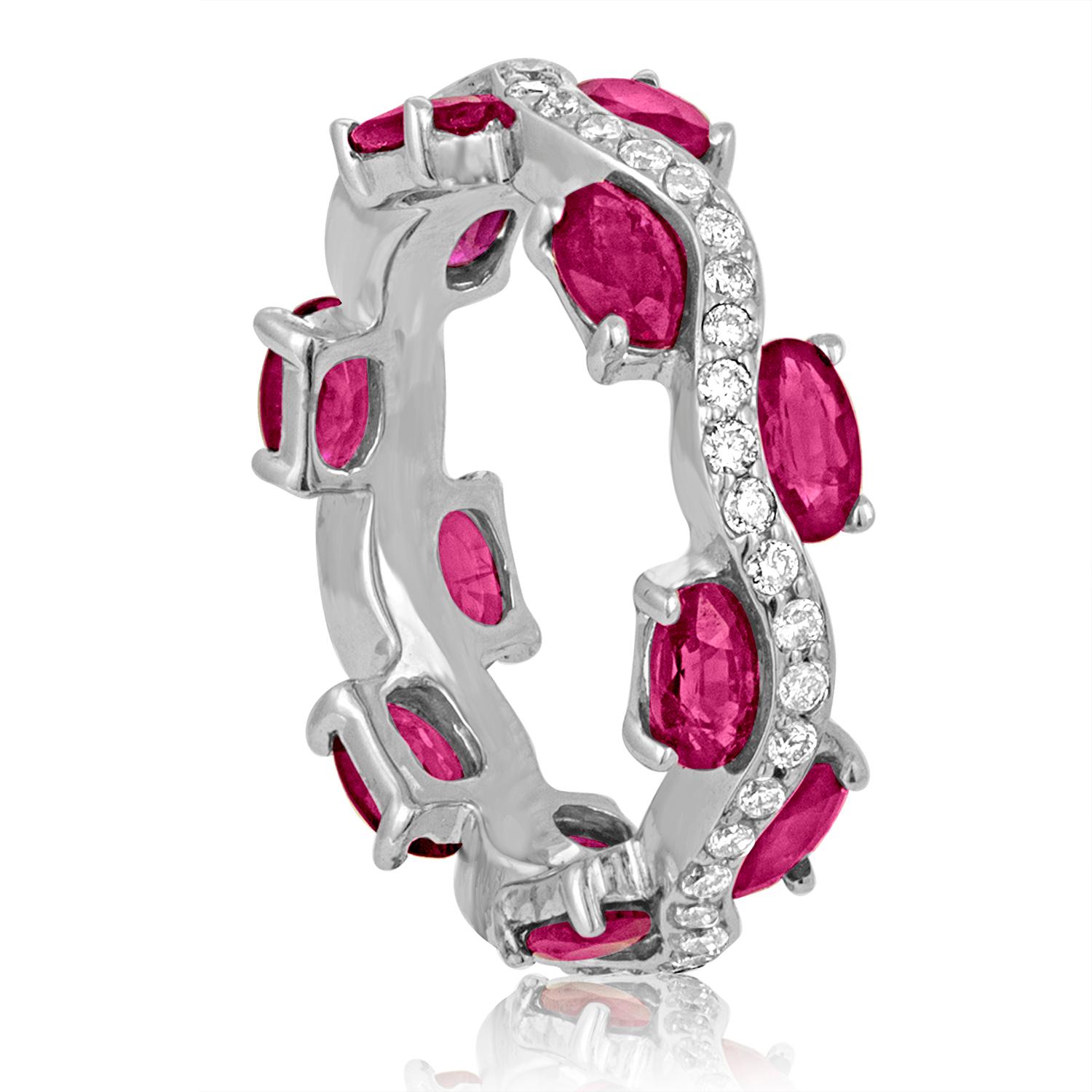 The ring is 18K White Gold
There are 2.00 Carats in Rubies
There are 0.50 Carats in Diamonds G SI
The ring weighs 5.4 grams
The ring is a size 6.5, not sizable