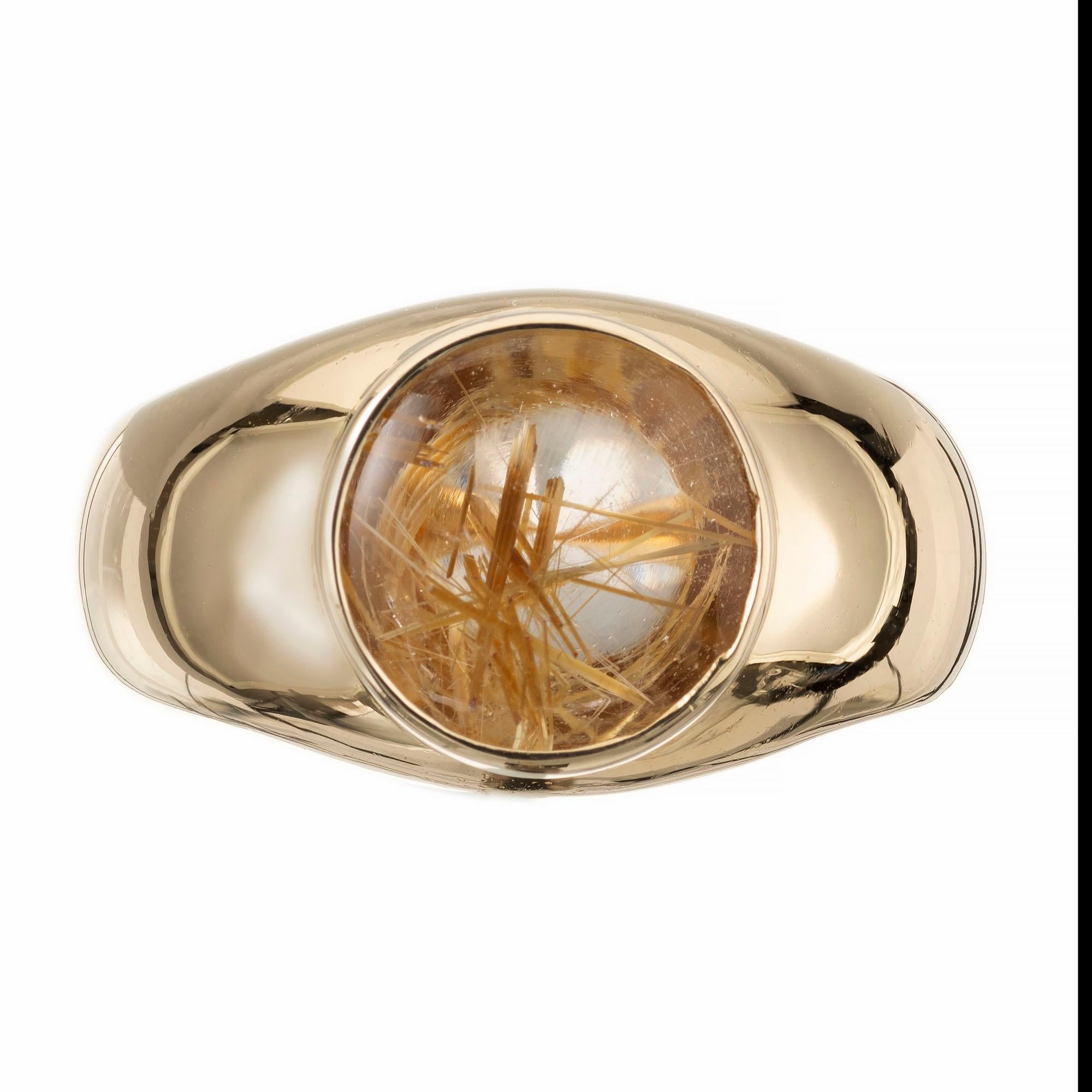 Unisex Bezel set natural Quartz with natural rutile needles set in a gold dome 18k yellow gold setting.  

1 round clear rutilated Quartz, approx. total weight 2.50cts, 10mm, Golden rutile needles
Size 8 1/2 and sizable
18k Yellow Gold
12.00