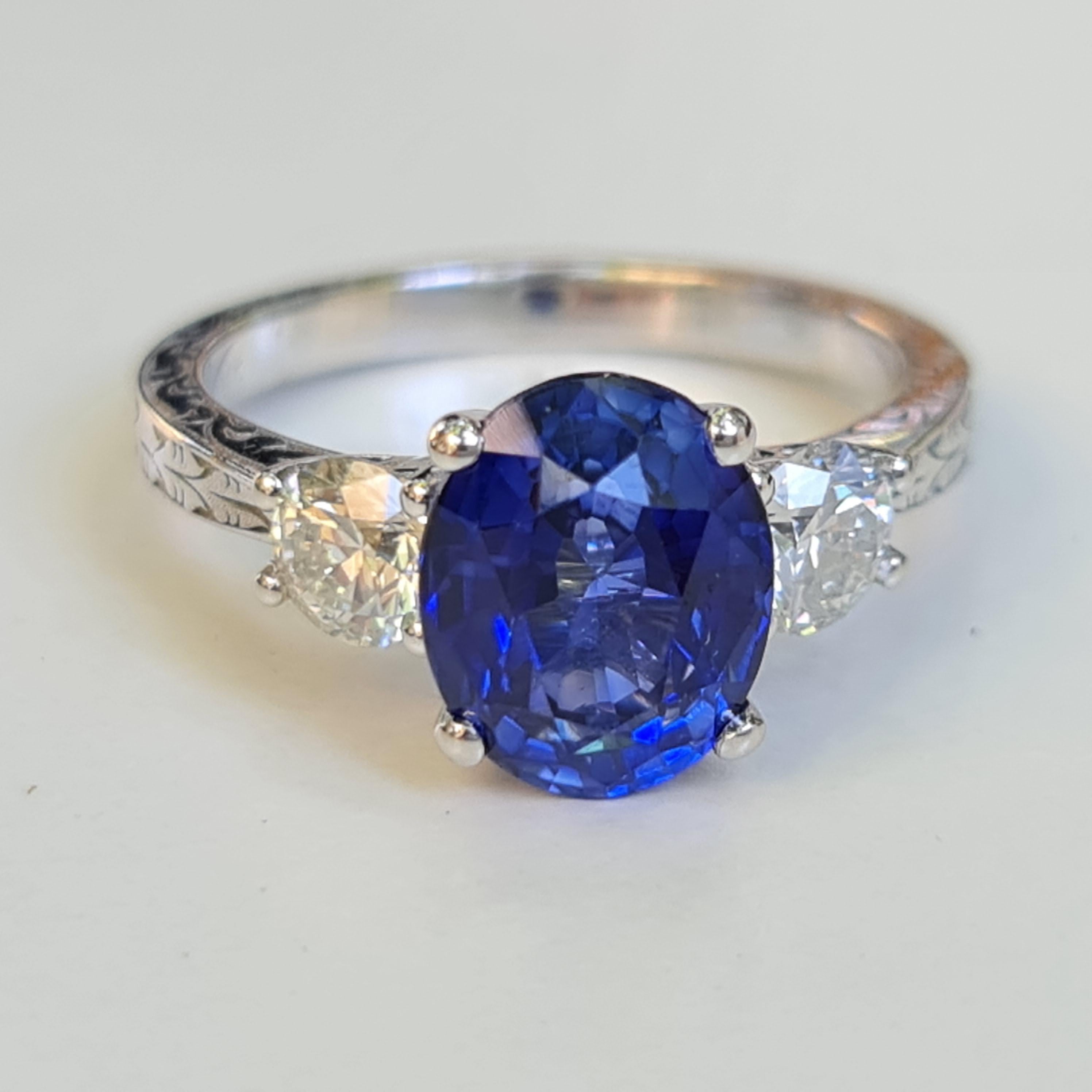 This stunning combination of deep blue sapphire and sparkling white diamonds is fit for the hand of a princess. A 2.50 carat sapphire offers elegant depth and color, surrounded by 2 individually-set VS white natural diamonds.

Whether this beautiful