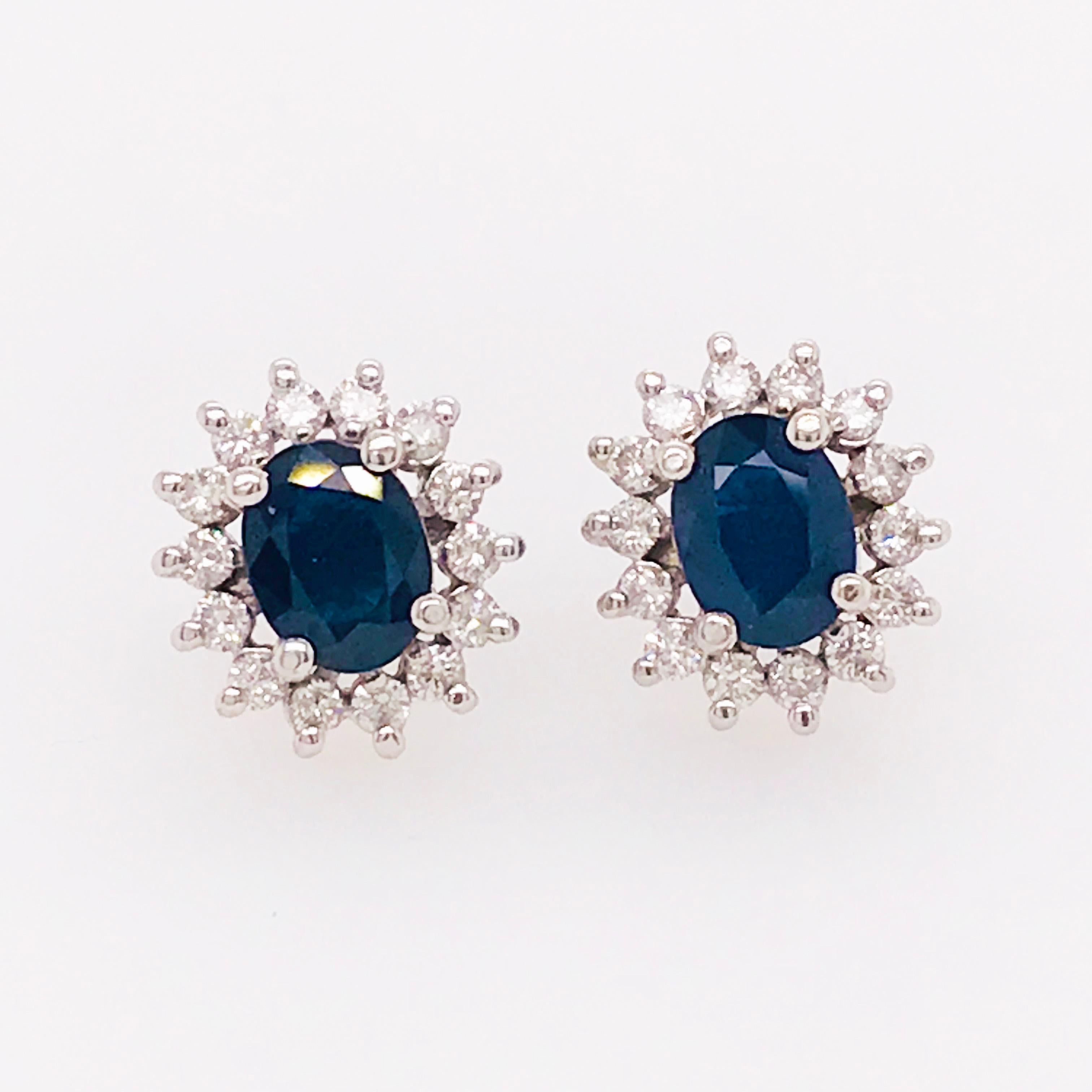 These sapphire and diamond estate earring studs are classic and timeless! With a genuine blue sapphire, cut in an oval shape, set in the center. The oval shape allows the blue color to showcase its brightest and most vibrant blue. 
Framing the