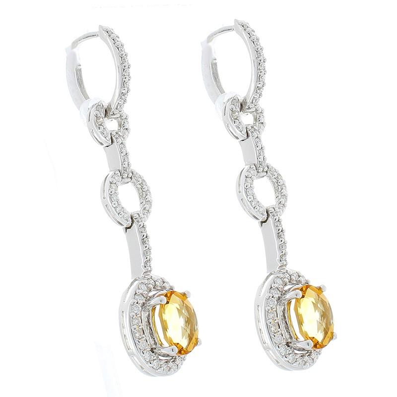 Impress onlookers and start conversations with these spectacular Brazilian citrine and diamond earrings. These earrings feature captivating elements that make them exceptionally charming. Lively checkerboard cut 2.50 carat total oval citrines draw