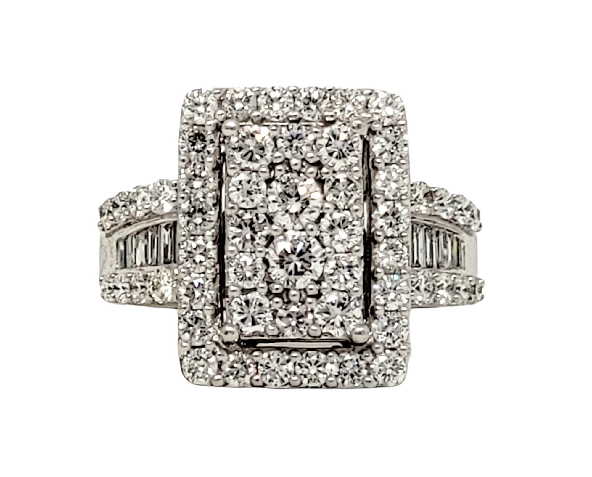 Ring size: 5.25

This stunningly sparkly diamond cluster ring makes an extravagant statement on the finger. Natural round brilliant and baguette diamonds fill this gorgeous piece from end to end, shimmering and shining from every angle. A multi-row