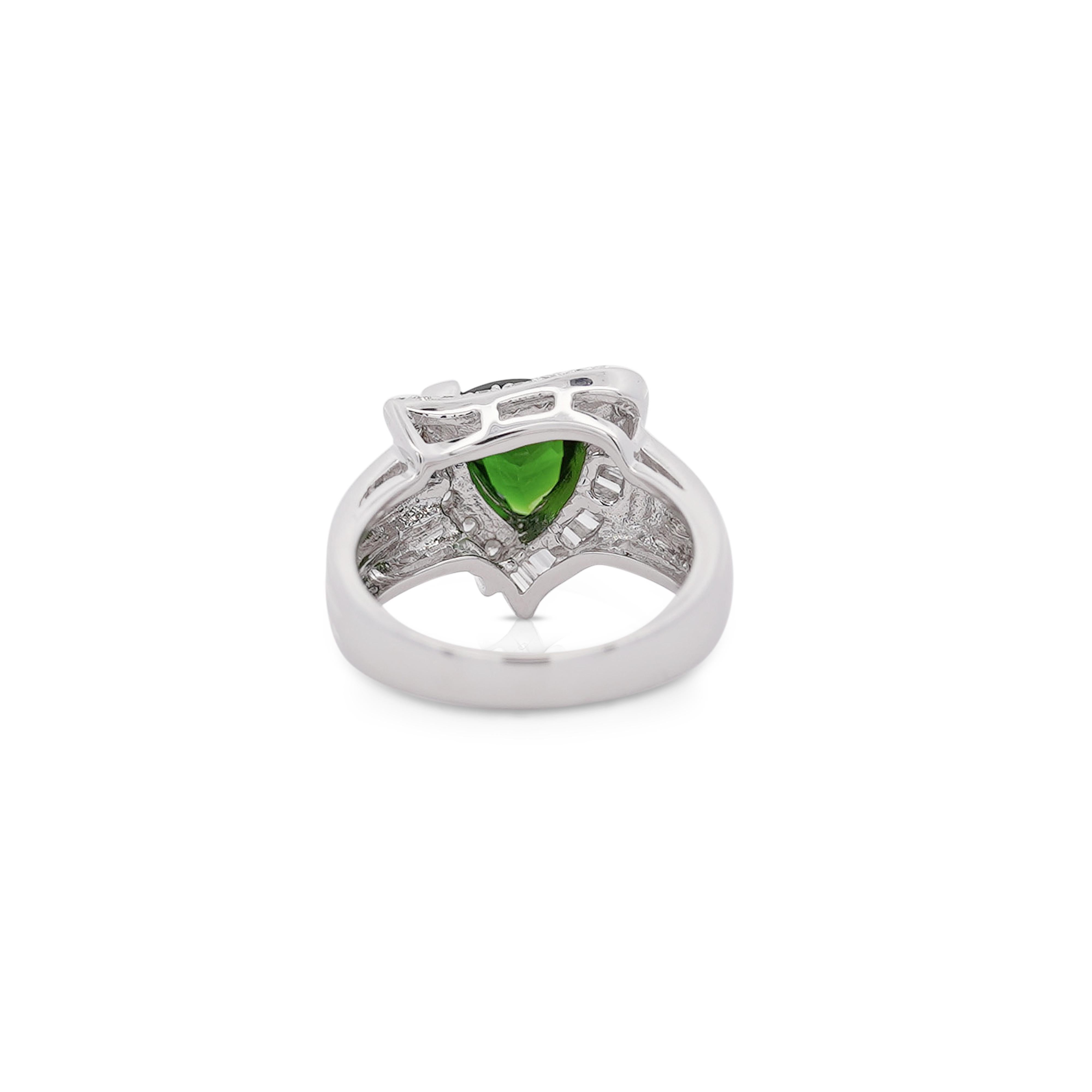 2.50 Carat Rich Green Trilliant Checkerboard Cut Tsavorite with 23 Round Diamonds and 9 Baguette Diamonds 18K White Gold Statement Ring. Featuring a smooth shank on one end and a ribbed textured shank on the other end. 

Details:
Item Type: