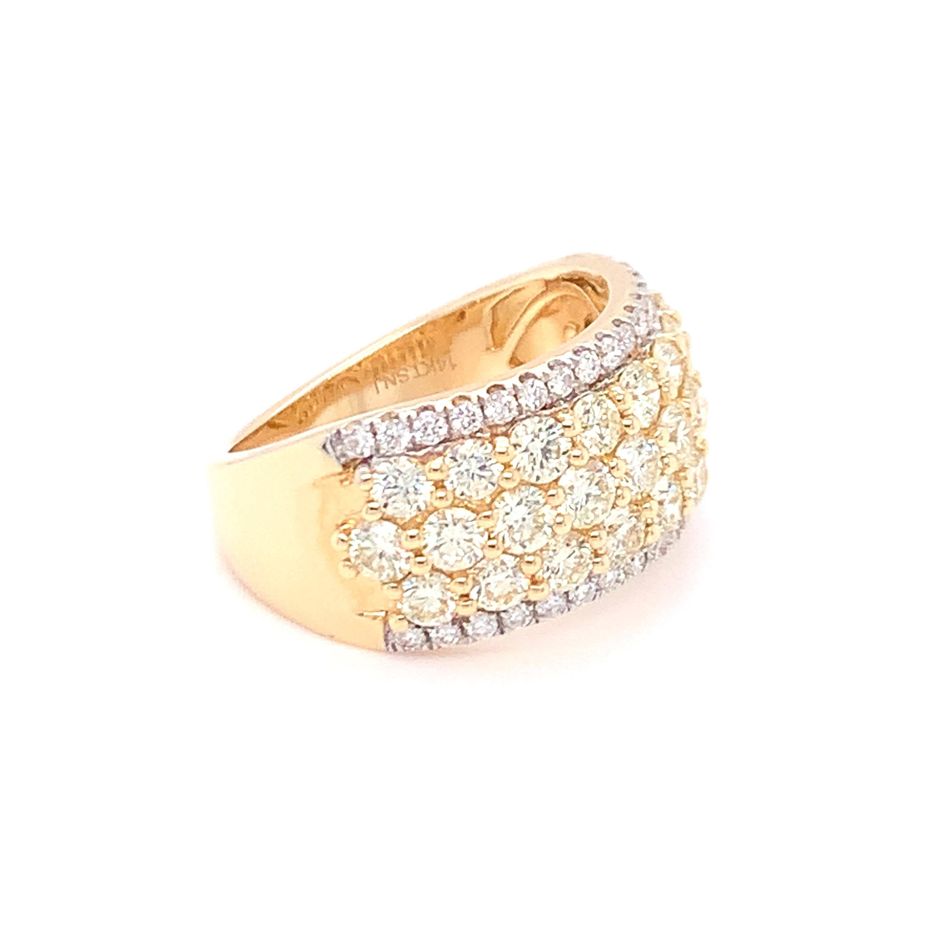 Three rows of yellow diamonds are set in between two rows of white diamonds on this stunning piece of band. Set in yellow gold and finished with skilled hands.
Total Diamond: 2.50ct
Gold: 14K Yellow
Ring Size:7