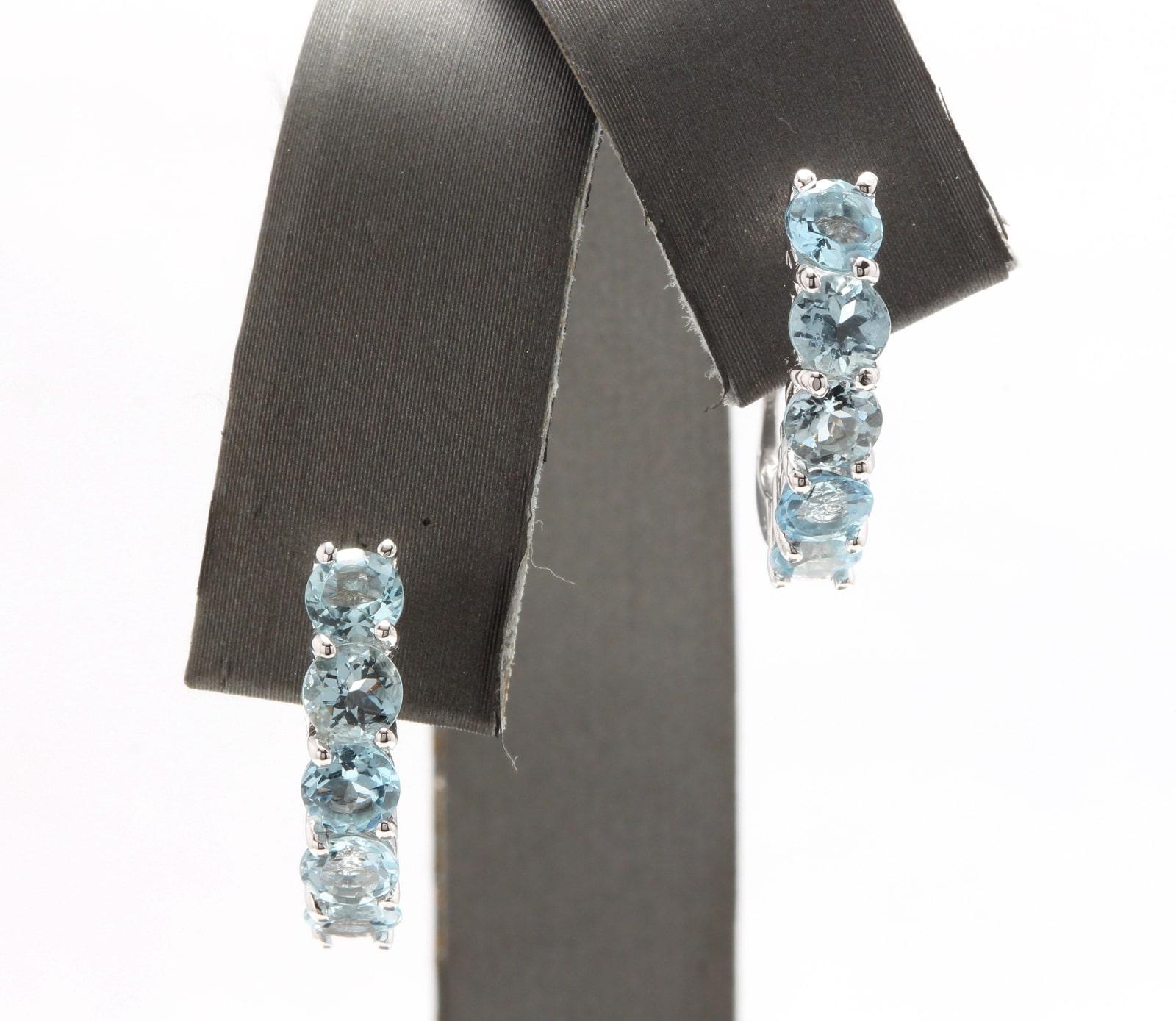 Exquisite 2.50 Carats Natural Aquamarine 14K Solid White Gold Huggie Earrings

Amazing looking piece! 

Total Natural Round Cut Blue Aquamarines Weight: 2.50 Carats (both earrings)

Aquamarine Measures: 4.2mm

Earring Measures: 17 x 16.3mm

Total