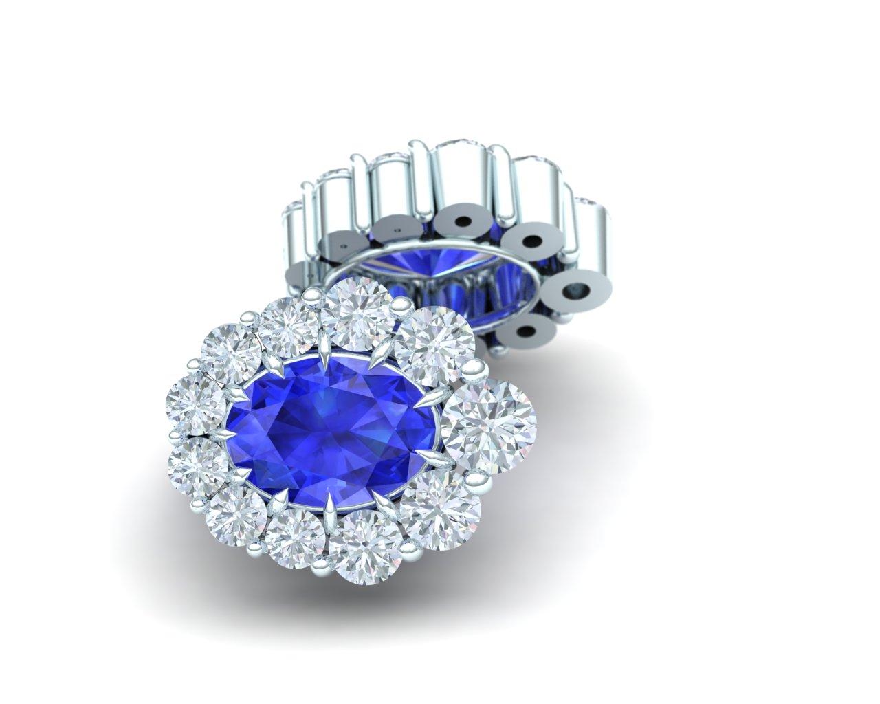 These classically inspired Sapphire and diamond earrings contain the following.  There are two Ceylon Blue oval cut sapphires that weigh between .60 carats and .70 carats each.  The Sapphires are complimented by over one carat of white round