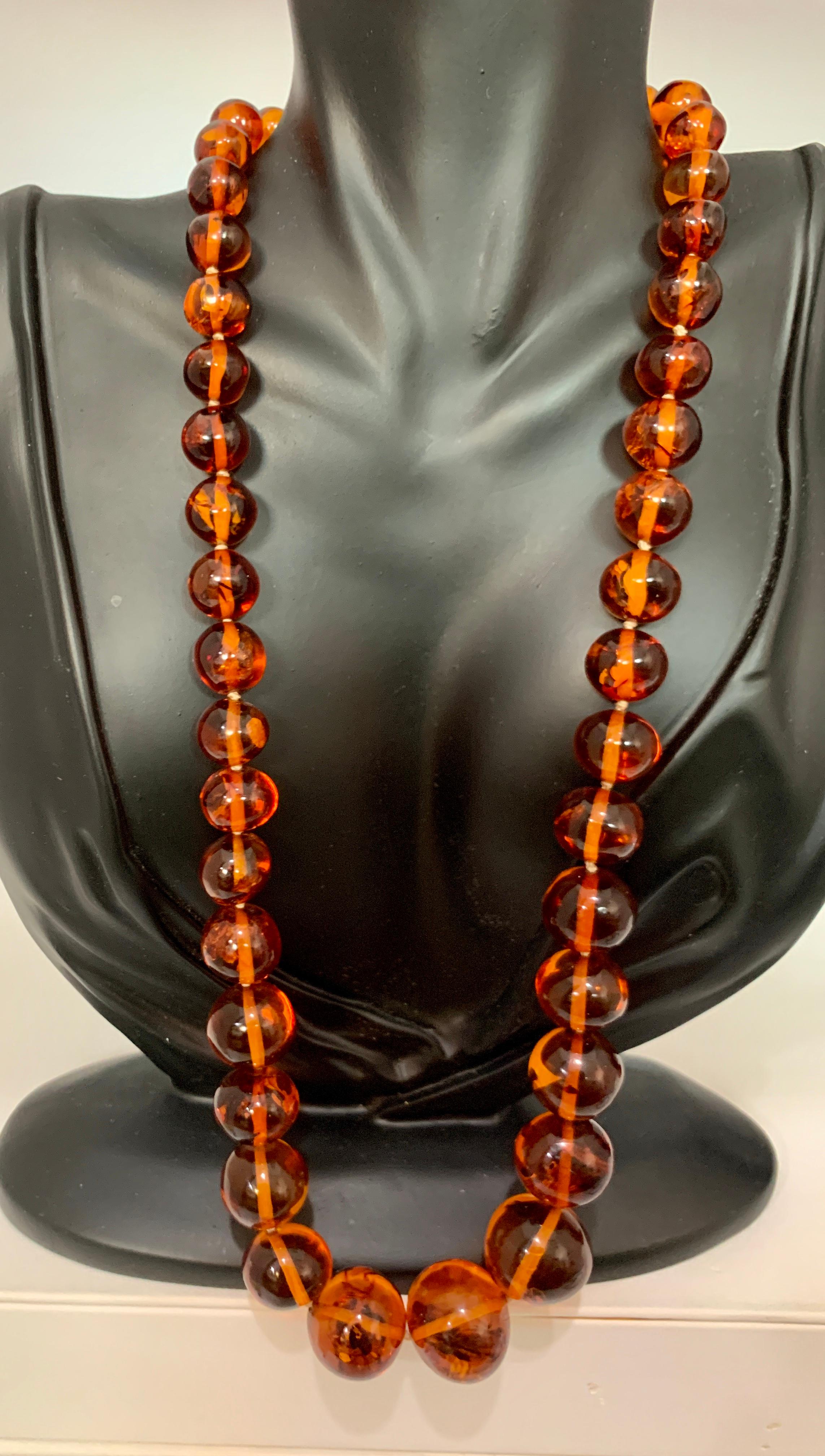 250 Ct Natural Amber Single Strand Graduating Bead Necklace with 18K Gold Clasp In Excellent Condition In New York, NY