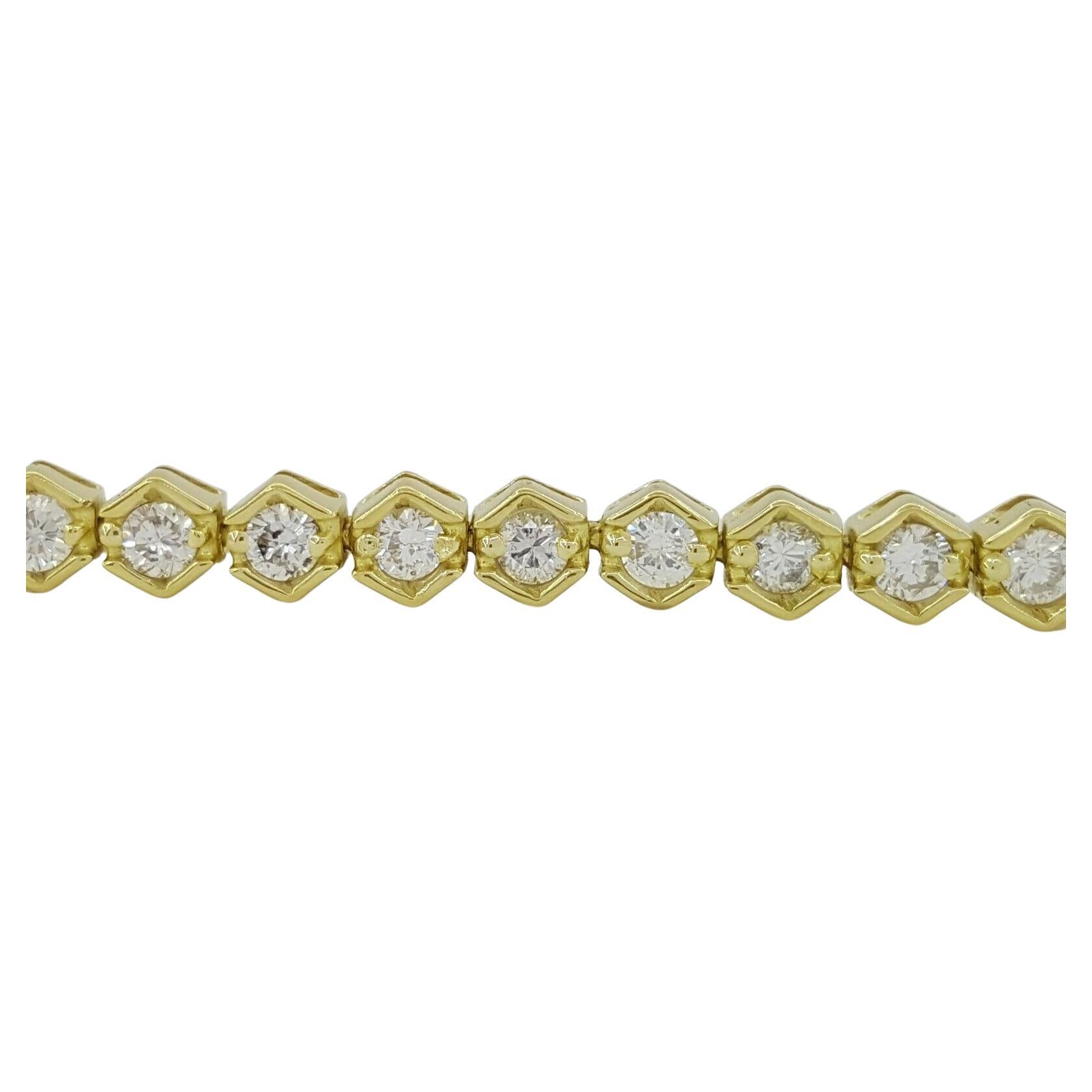 Bracelet tennis en or jaune 18K avec diamants ronds et brillants d'un poids total de 2,5 ct.
