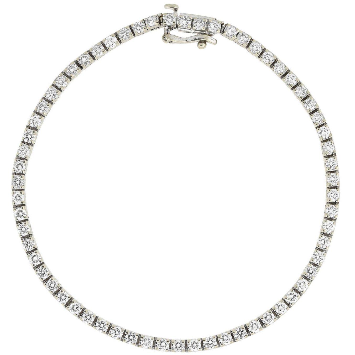 A gorgeous Vintage diamond line bracelet from the 1950s era! Crafted in 14kt white gold, this fabulous piece features a uniform line of sparkling diamonds which are each prong set in an individual hinged box setting. With approximately 2.50ctw of