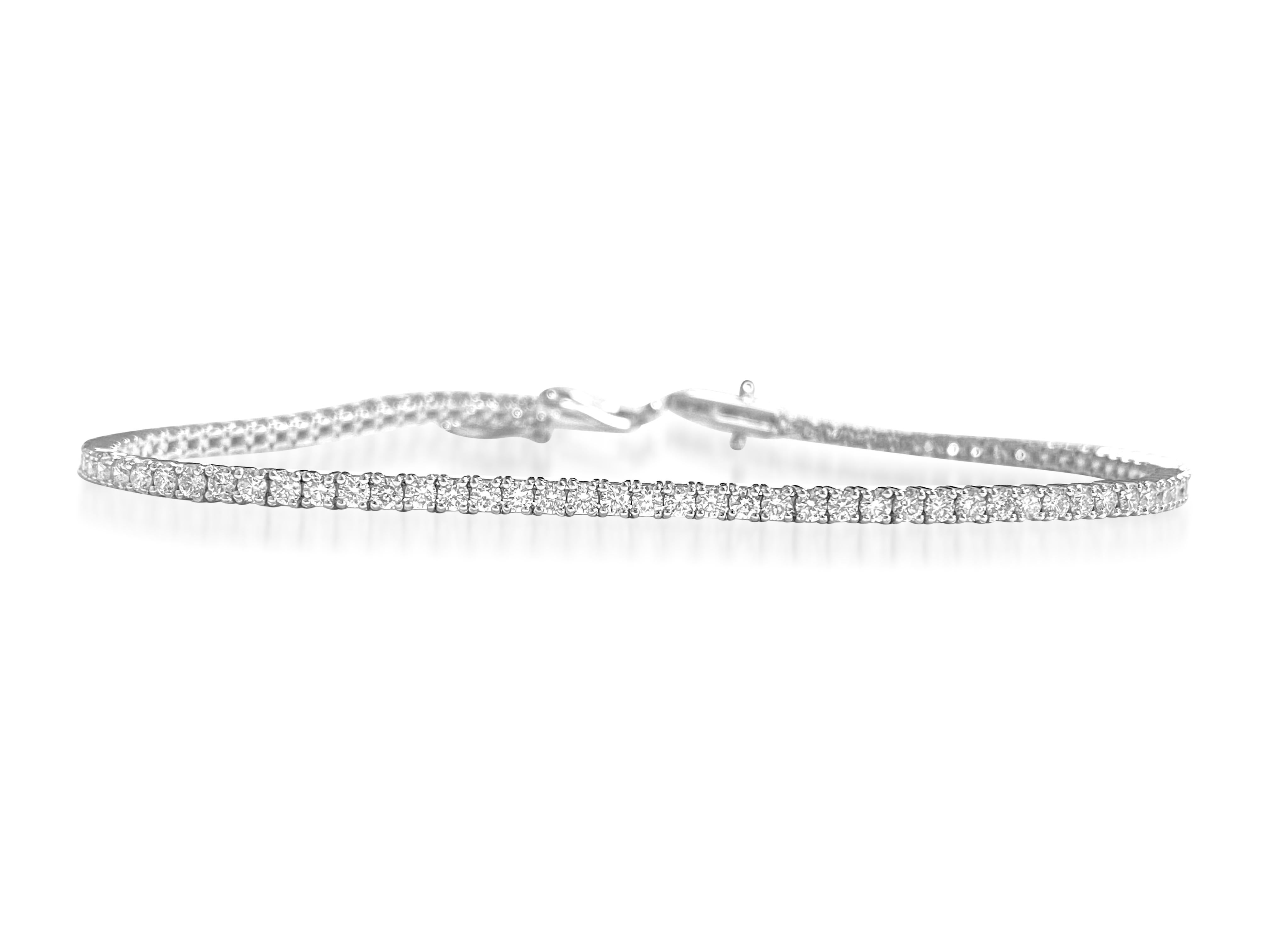 Fashioned from stunning 14k white gold, this elegant diamond tennis bracelet boasts a total weight of 2.50 carats, adorned with sparkling VS clarity diamonds. Each diamond is meticulously set to perfection, showcasing their natural brilliance and