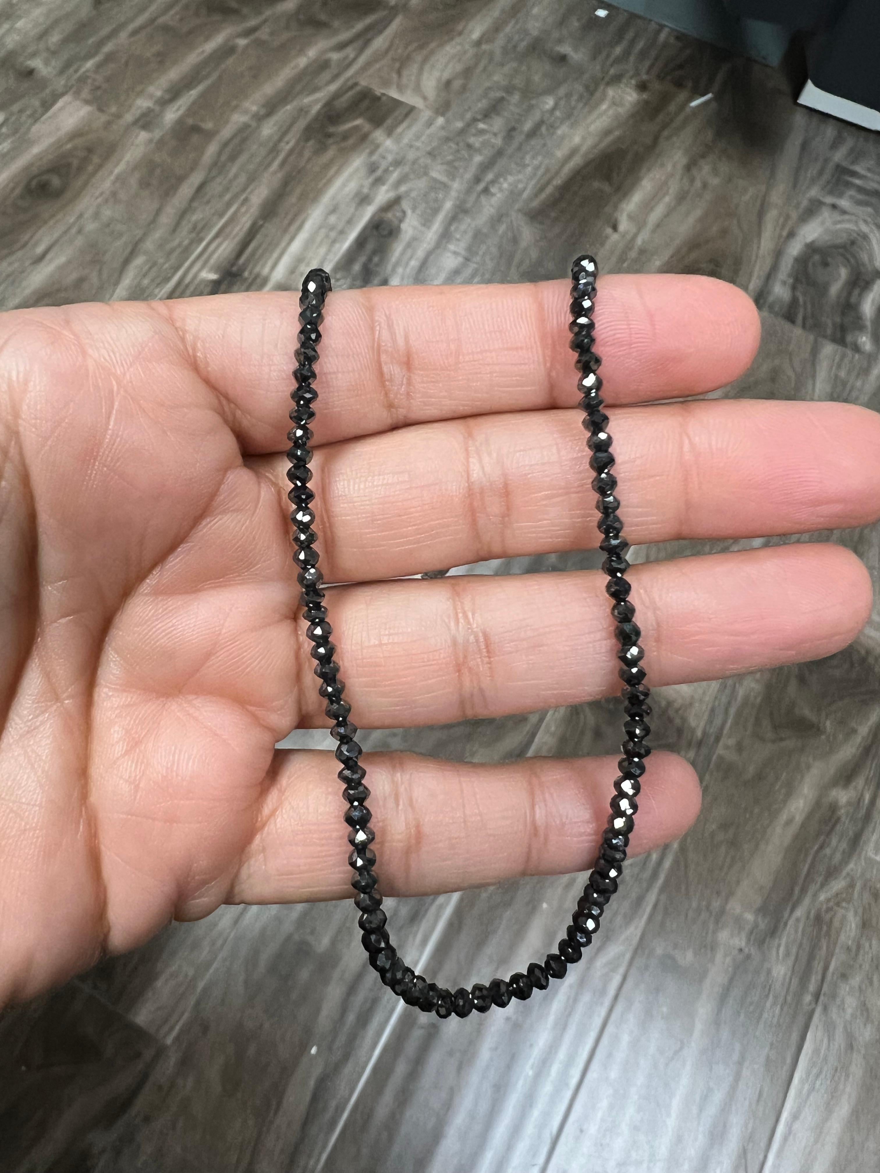 This necklace has 25.00 carats of Natural Briolette Cut Black Diamonds. 

It is approximately 16 inches in length and has a clasp made out of 18 Karat White Gold. 

The black diamonds are natural but have been color treated as per industry standards