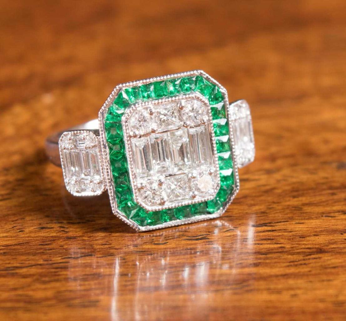 The Following Items we are offering is a Rare Important Radiant 18KT WHITE GOLD LARGE DIAMOND AND EMERALD VENETIAN  ART DECO STYLE RING. Ring is comprised with a Large Finely Set Sparkling Baguette Clusters of Faceted Diamonds surrounded with a Halo