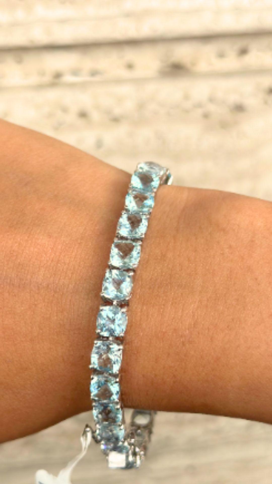 25.01 Carats Cushion cut Aquamarine Tennis Bracelet in sterling silver showcases endlessly sparkling natural aquamarine, weighing 25.01 carat. It measures 7.25 inches long in length. 
Aquamrine stimulate concentration and reduces stress. 
Designed