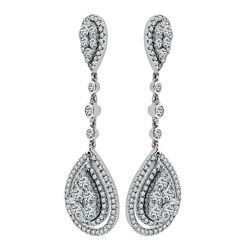 This is an amazing pair of 14k white gold drop earrings. The earrings feature sparkling round cut diamonds that weigh approximately 2.50ct. The color of these diamonds is G with VS clarity. The earrings measure 42mm by 13mm and weigh 7.5 grams. The