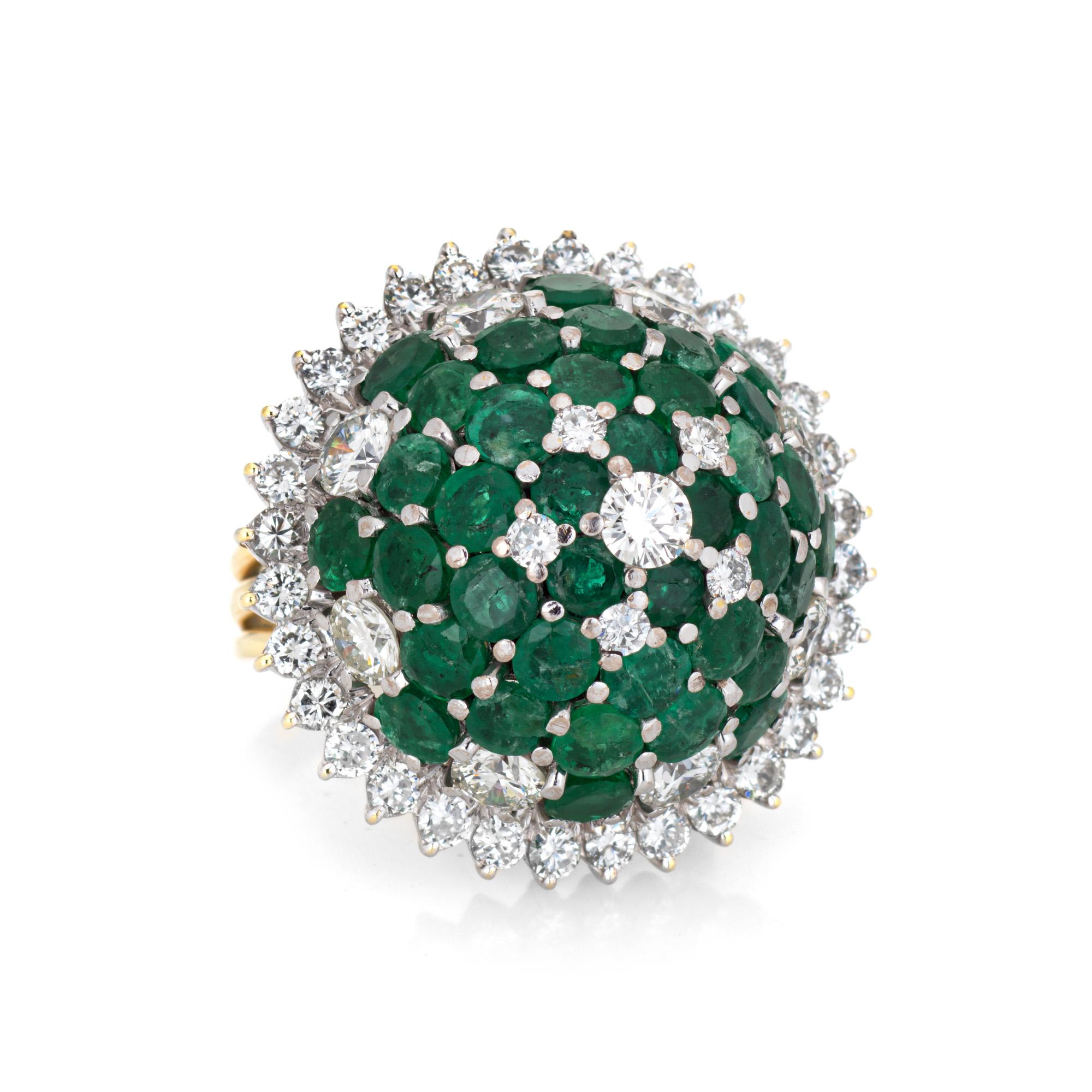 Stylish diamond & emerald cocktail ring crafted in 18 karat yellow & white gold (circa 1960s). 

Round brilliant cut diamonds total an estimated 2.50 carats (estimated at G-H color and VS2-SI1 clarity). Emeralds graduate in size from 2mm to 3mm. The