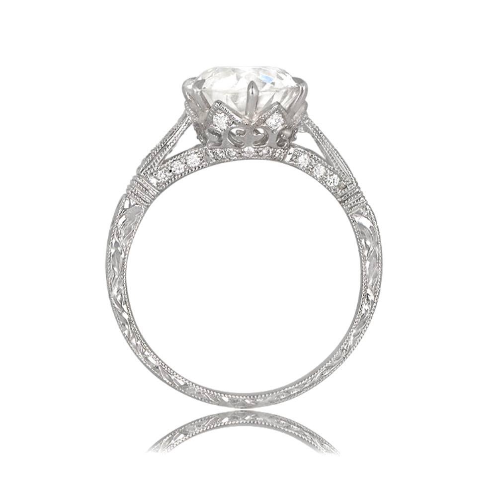 A stunning engagement ring with a 2.50 carat old European cut diamond of K color and VS2 clarity, set in a crown-style prong setting. Additional diamonds accent the shoulders and shank, with a total weight of approximately 0.18 carats. The band