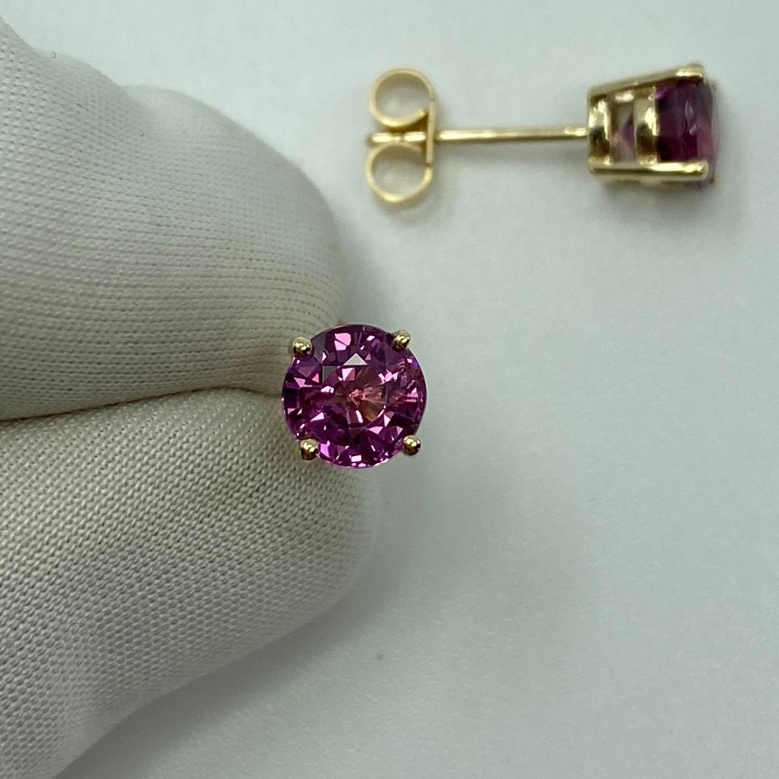 Vivid Pink Purple 2.50 Carat Rhodolite Garnet Yellow Gold Earring Studs.

Beautiful 6 mm matching pair of round garnets with vivid colour, excellent clarity and an excellent round brilliant cut.

Set in fine 9k yellow gold studs with butterfly