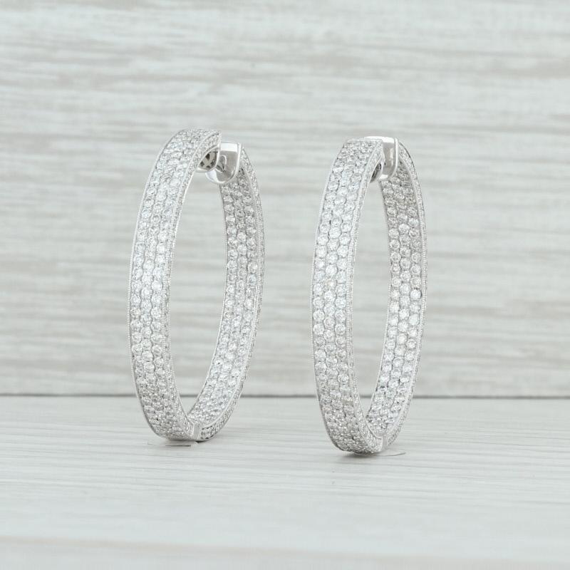 These beautiful earrings are set with 2.5 carats of sparkling diamonds! The diamonds are pave set in three rows across the front of the outside and front or the interior for a stunning shimmer. Diamond are also set along the outer rim of each side.