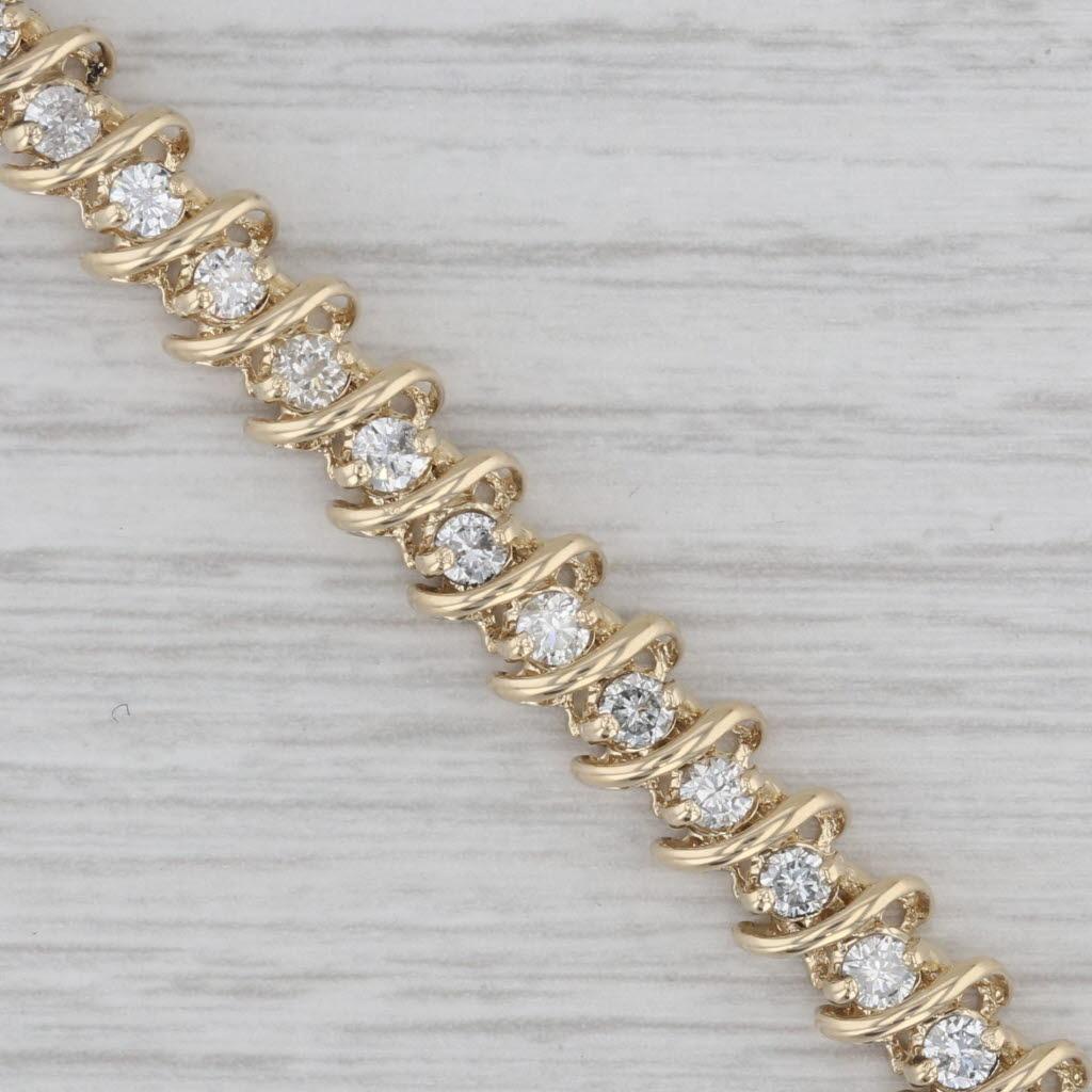Informazioni sulla gemma:
- Diamanti naturali -
Carati totali - 2,50ctw
Taglio - Brillante rotondo
Colore - F - H.
Chiarezza - SI1 - I1

Metallo: oro giallo 14k
Peso: 15.7 grammi 
Timbri: 14k
Stile della catena: Tennis
Chiusura: a