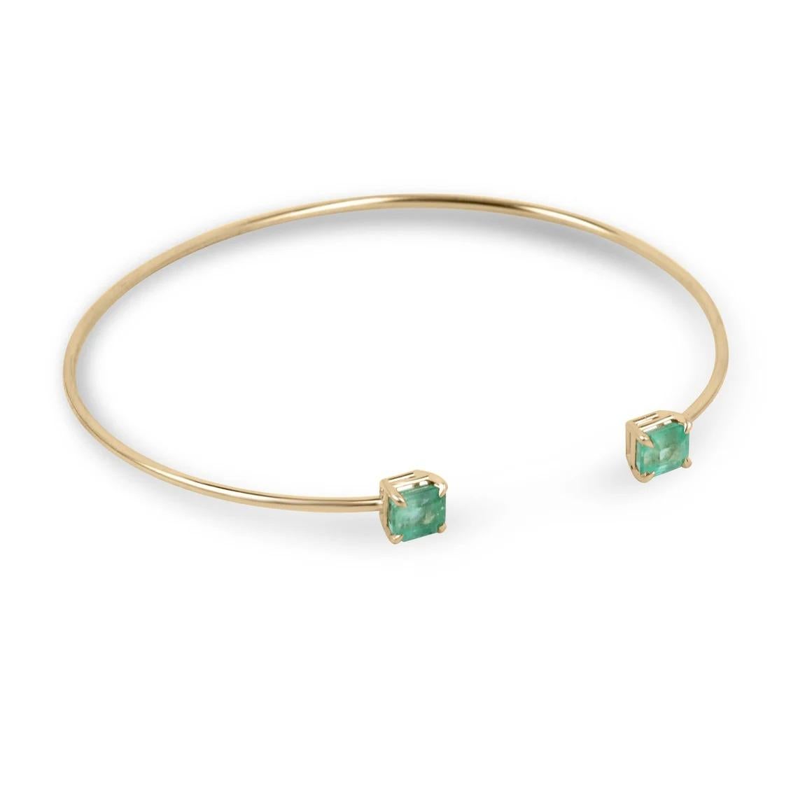 The toi et moi cuff bangle bracelet is a stunning piece of jewelry that symbolizes the intertwining of two individuals. This exquisite bracelet features two asscher cut emeralds, weighing a total of 2.50 carats, set in a four claw prong setting. The