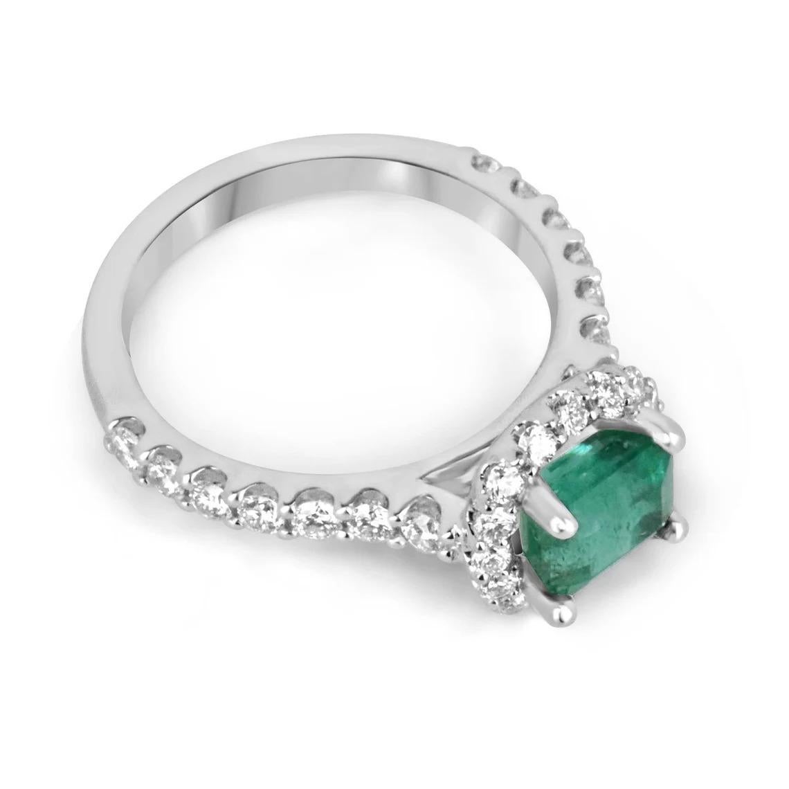Behold a mesmerizing emerald and diamond engagement ring that captures the essence of timeless elegance. Featuring a magnificent 1.70-carat emerald cut emerald, the vibrant gemstone takes center stage as it is set horizontally, east to west, within