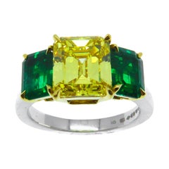 2.51 Carat Fancy Vivid Yellow Diamond and Emerald Ring